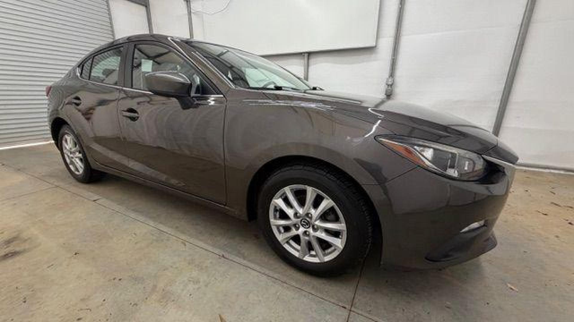 2014 Bronze Mazda Mazda3 i Touring (JM1BM1V74E1) with an SKYACTIV-G 2L I-4 gasoline direct injection engine, located at 1806 Veterans Memorial Hwy SW, Austell, GA, 30168, (770) 944-9558, 33.817959, -84.606987 - Photo#7