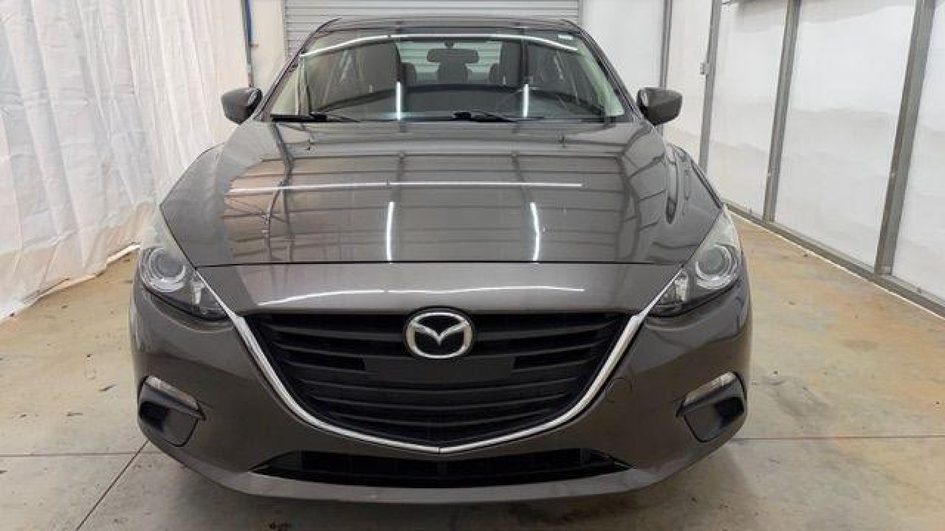 2014 Bronze Mazda Mazda3 i Touring (JM1BM1V74E1) with an SKYACTIV-G 2L I-4 gasoline direct injection engine, located at 1806 Veterans Memorial Hwy SW, Austell, GA, 30168, (770) 944-9558, 33.817959, -84.606987 - Photo#9