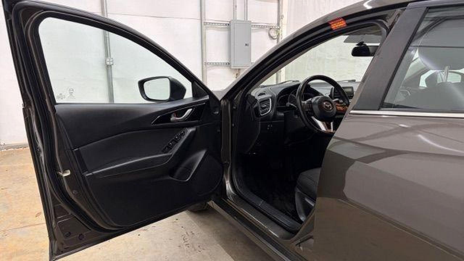 2014 Bronze Mazda Mazda3 i Touring (JM1BM1V74E1) with an SKYACTIV-G 2L I-4 gasoline direct injection engine, located at 1806 Veterans Memorial Hwy SW, Austell, GA, 30168, (770) 944-9558, 33.817959, -84.606987 - Photo#10