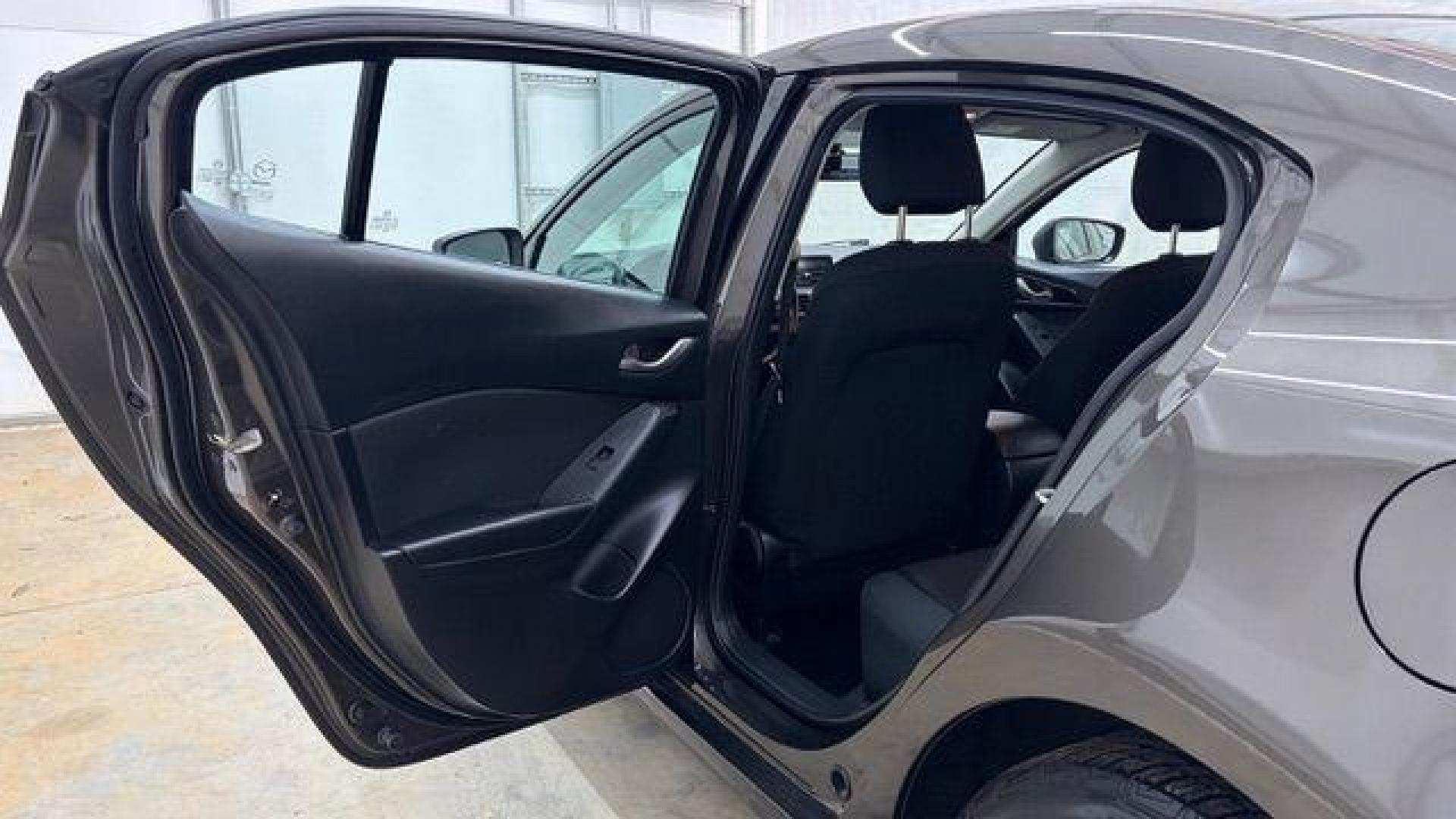 2014 Bronze Mazda Mazda3 i Touring (JM1BM1V74E1) with an SKYACTIV-G 2L I-4 gasoline direct injection engine, located at 1806 Veterans Memorial Hwy SW, Austell, GA, 30168, (770) 944-9558, 33.817959, -84.606987 - Photo#13