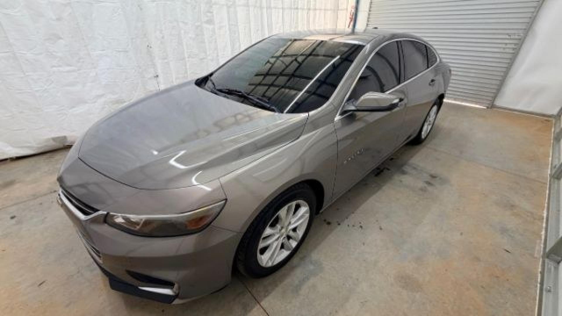 2017 Brown Chevrolet Malibu 1LT (1G1ZE5ST8HF) with an 1.5L I-4 gasoline direct injection engine, located at 1806 Veterans Memorial Hwy SW, Austell, GA, 30168, (770) 944-9558, 33.817959, -84.606987 - Photo#1