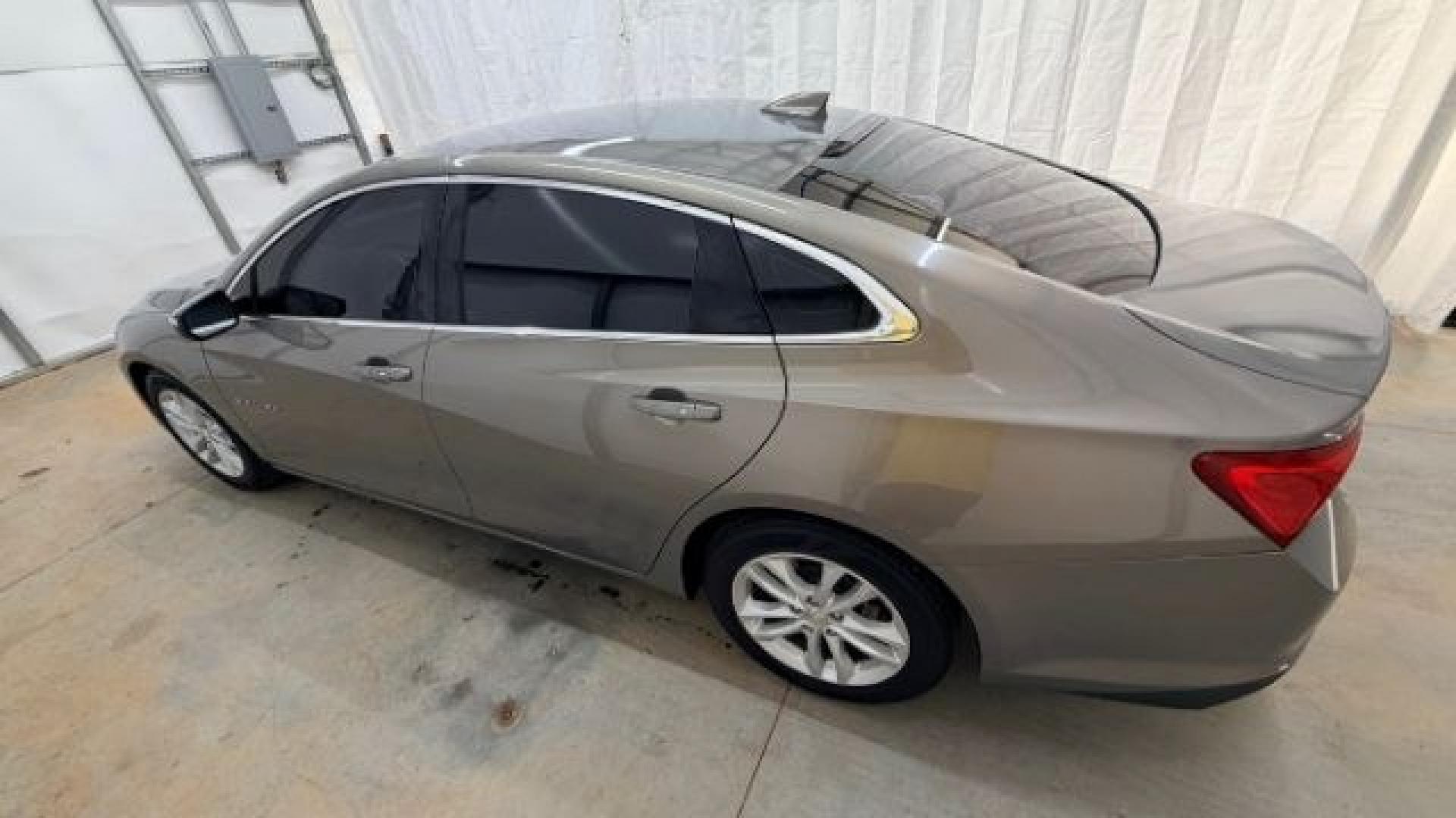 2017 Brown Chevrolet Malibu 1LT (1G1ZE5ST8HF) with an 1.5L I-4 gasoline direct injection engine, located at 1806 Veterans Memorial Hwy SW, Austell, GA, 30168, (770) 944-9558, 33.817959, -84.606987 - Photo#2