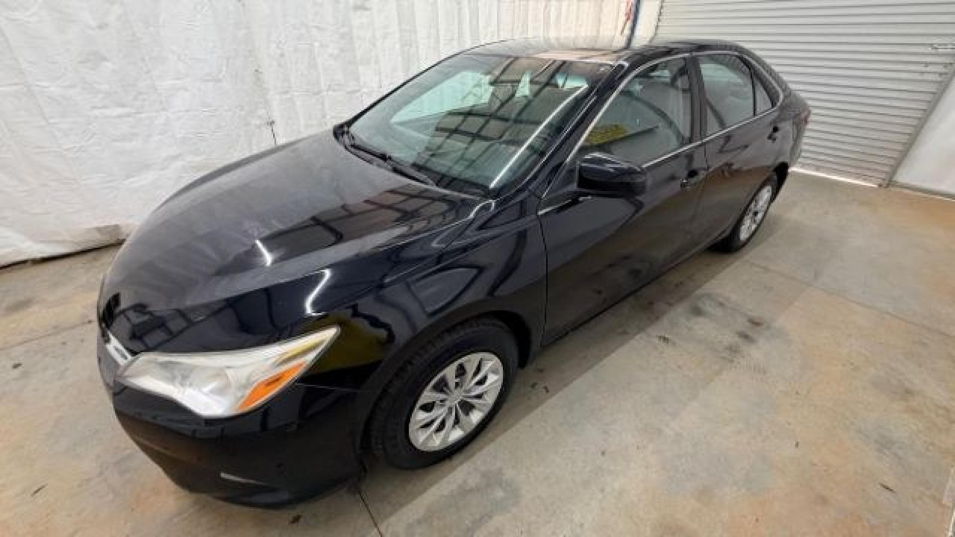 2016 Black Toyota Camry LE (4T1BF1FK5GU) with an 2.5L I-4 DOHC engine, located at 1806 Veterans Memorial Hwy SW, Austell, GA, 30168, (770) 944-9558, 33.817959, -84.606987- Photo#1