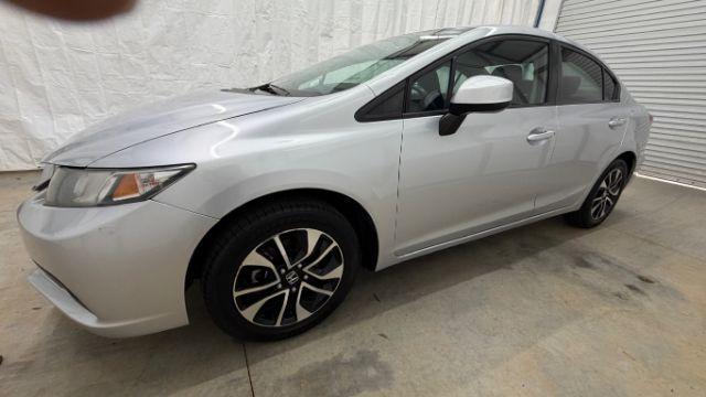 2013 Silver Honda Civic LX (2HGFB2F57DH) with an 1.8L I-4 i-VTEC variable valve control engine, located at 1806 Veterans Memorial Hwy SW, Austell, GA, 30168, (770) 944-9558, 33.817959, -84.606987 - Photo#1