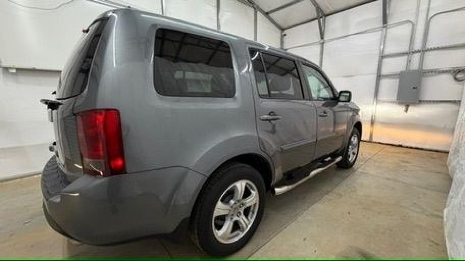 2012 Gray Honda Pilot EX-L (5FNYF3H52CB) with an 3.5L V-6 i-VTEC VCM variable valve control engine, located at 1806 Veterans Memorial Hwy SW, Austell, GA, 30168, (770) 944-9558, 33.817959, -84.606987- Photo#6