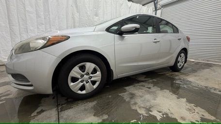 2015 Silver Kia Forte LX (KNAFK4A65F5) with an 1.8L I-4 DOHC engine, located at 1806 Veterans Memorial Hwy SW, Austell, GA, 30168, (770) 944-9558, 33.817959, -84.606987 - Photo#1