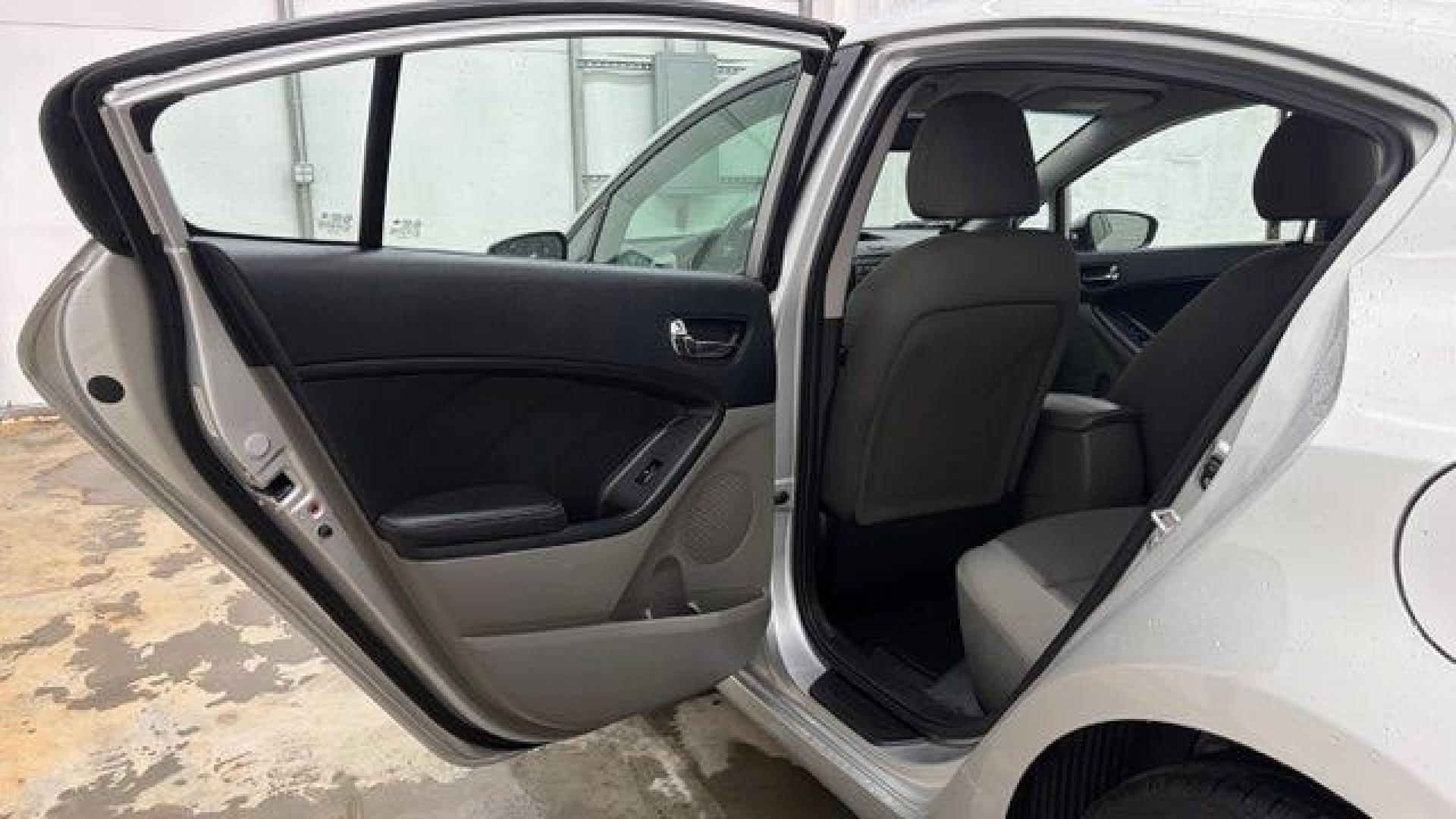 2015 Silver Kia Forte LX (KNAFK4A65F5) with an 1.8L I-4 DOHC engine, located at 1806 Veterans Memorial Hwy SW, Austell, GA, 30168, (770) 944-9558, 33.817959, -84.606987- Photo#13