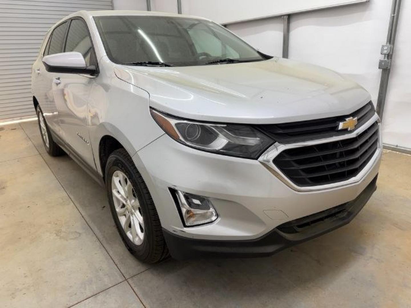 2018 Silver Chevrolet Equinox LT (3GNAXSEVXJS) with an 1.5L I-4 gasoline direct injection engine, located at 1806 Veterans Memorial Hwy SW, Austell, GA, 30168, (770) 944-9558, 33.817959, -84.606987 - Photo#8
