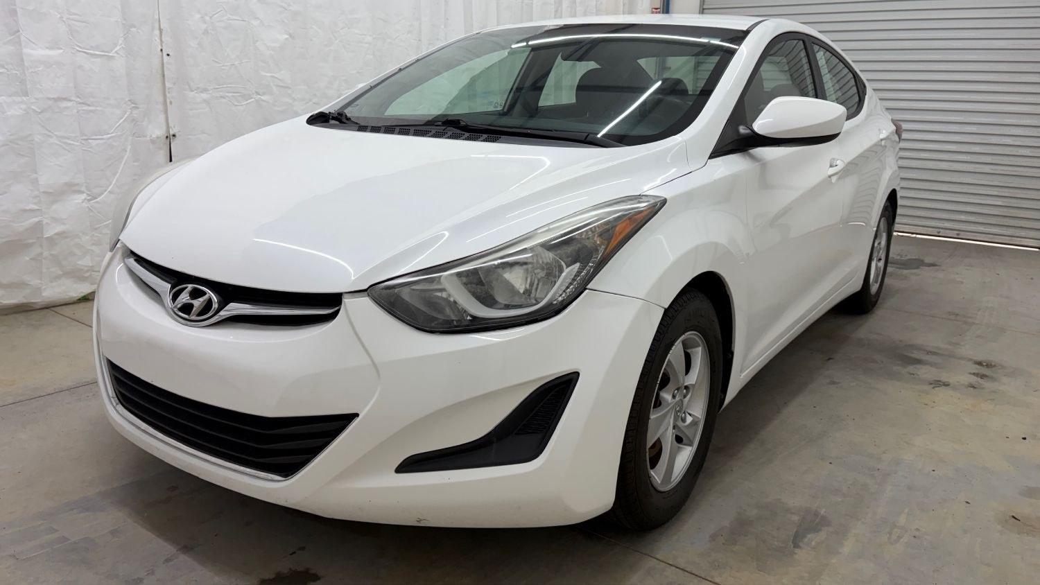 2014 White Hyundai Elantra SE (5NPDH4AE5EH) with an Nu 1.8L I-4 DOHC engine, located at 1806 Veterans Memorial Hwy SW, Austell, GA, 30168, (770) 944-9558, 33.817959, -84.606987- Photo#0