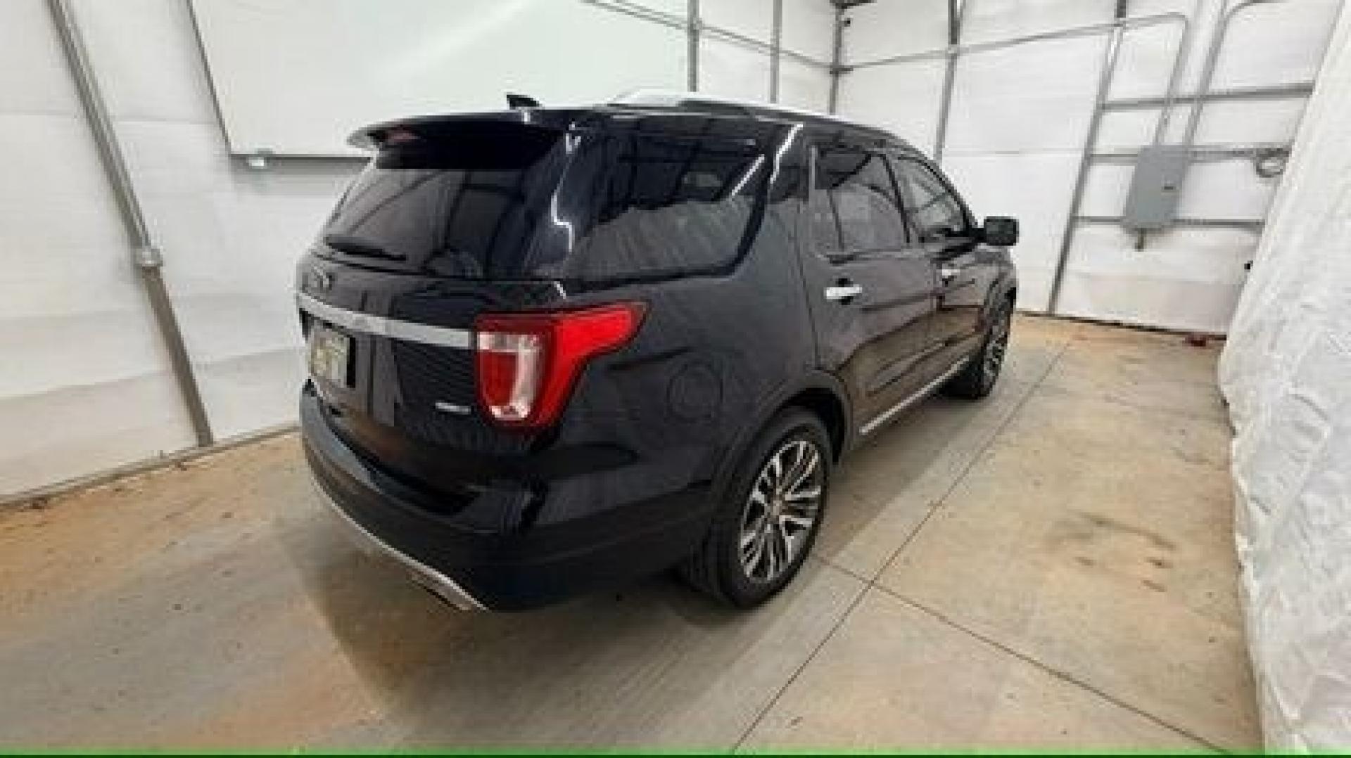 2016 Black Ford Explorer Platinum (1FM5K8HT0GG) with an EcoBoost 3.5L V-6 gasoline direct injection engine, located at 1806 Veterans Memorial Hwy SW, Austell, GA, 30168, (770) 944-9558, 33.817959, -84.606987 - Photo#5