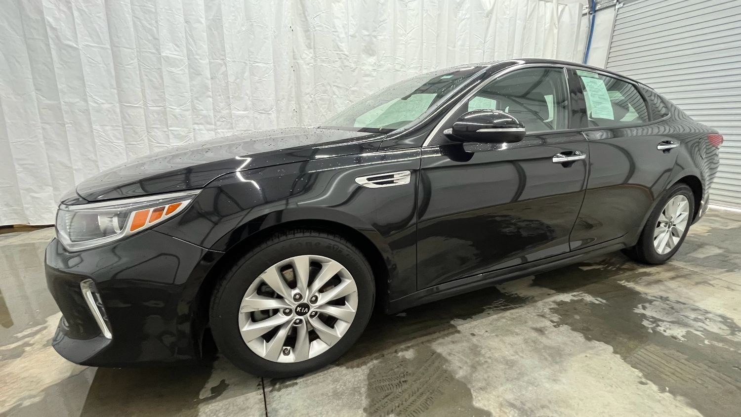 2018 Black Kia Optima EX (5XXGU4L30JG) with an Theta II 2.4L I-4 gasoline direct injection engine, located at 1806 Veterans Memorial Hwy SW, Austell, GA, 30168, (770) 944-9558, 33.817959, -84.606987 - Photo#1