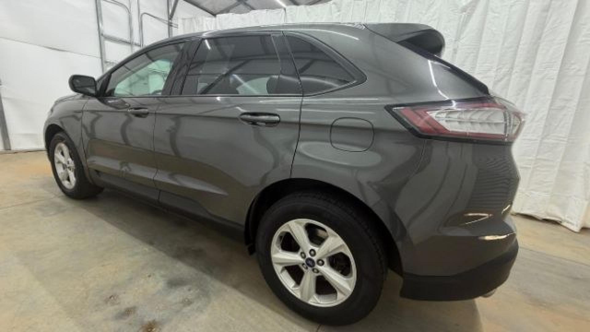 2016 Gray Ford Edge SE (2FMPK4G98GB) with an EcoBoost 2L I-4 gasoline direct injection engine, located at 1806 Veterans Memorial Hwy SW, Austell, GA, 30168, (770) 944-9558, 33.817959, -84.606987 - Photo#2