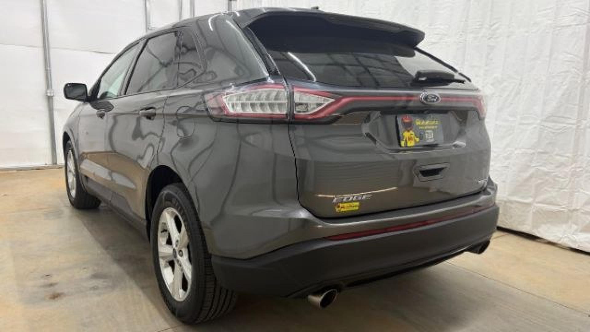 2016 Gray Ford Edge SE (2FMPK4G98GB) with an EcoBoost 2L I-4 gasoline direct injection engine, located at 1806 Veterans Memorial Hwy SW, Austell, GA, 30168, (770) 944-9558, 33.817959, -84.606987 - Photo#3