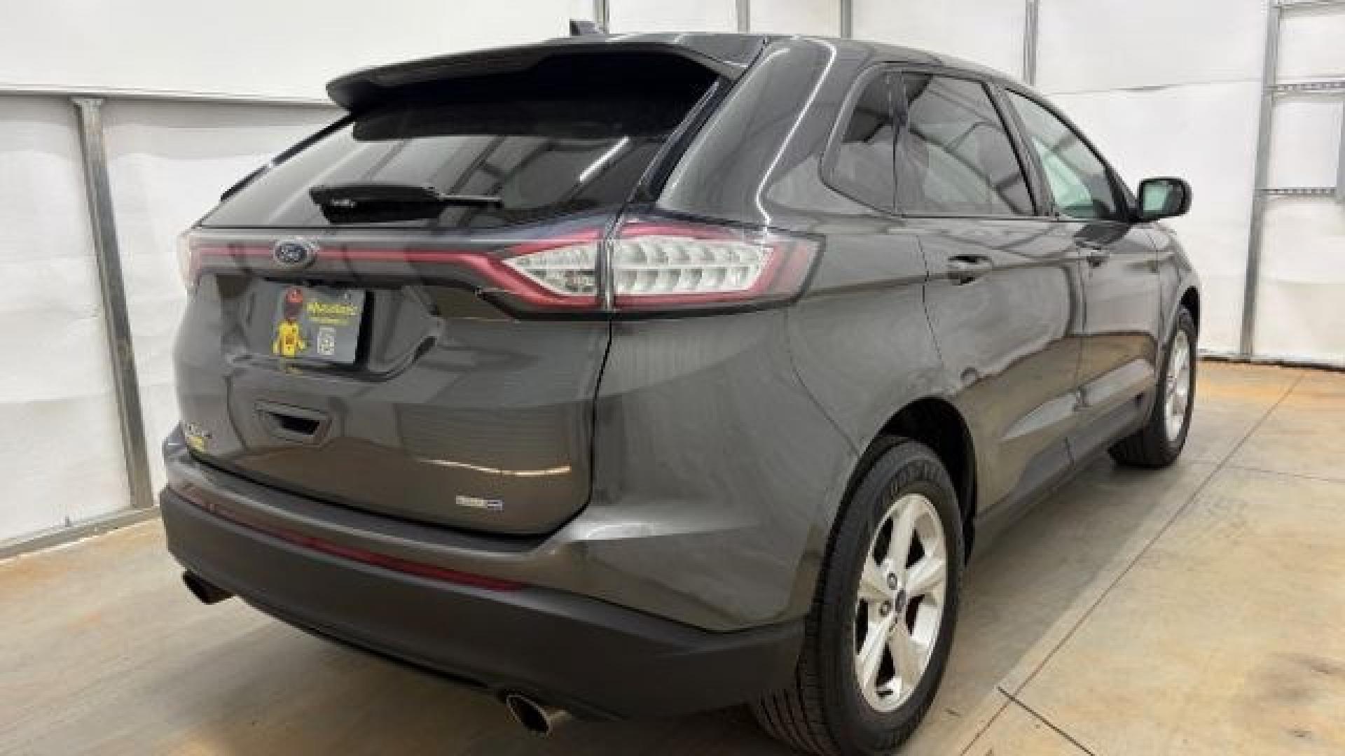 2016 Gray Ford Edge SE (2FMPK4G98GB) with an EcoBoost 2L I-4 gasoline direct injection engine, located at 1806 Veterans Memorial Hwy SW, Austell, GA, 30168, (770) 944-9558, 33.817959, -84.606987 - Photo#6