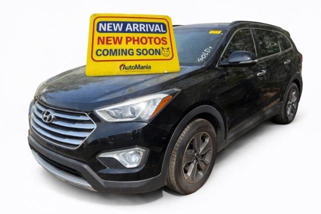 2014 Black Hyundai Santa Fe Limited (KM8SN4HF5EU) with an Lambda II 3.3L V-6 gasoline direct injection engine, located at 1806 Veterans Memorial Hwy SW, Austell, GA, 30168, (770) 944-9558, 33.817959, -84.606987 - Photo#0