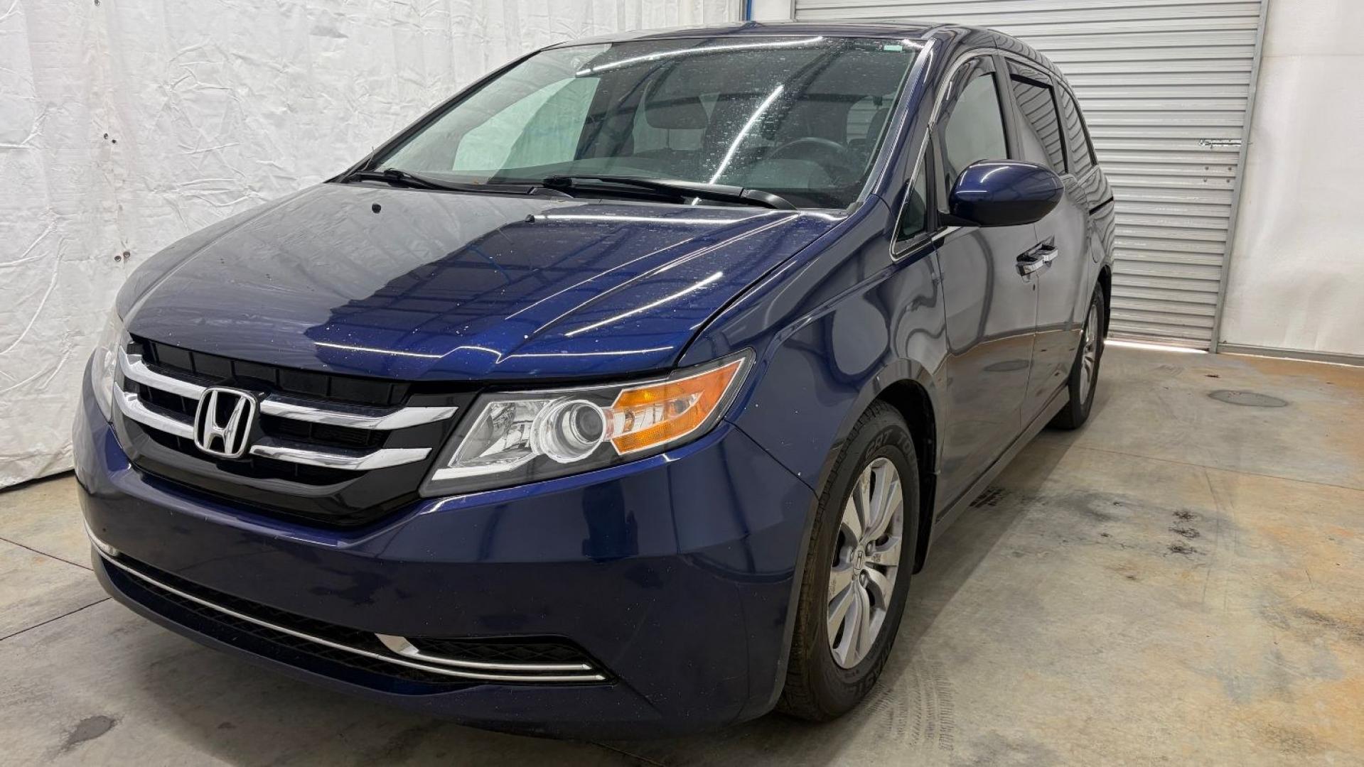 2016 Blue Honda Odyssey EX-L (5FNRL5H66GB) with an 3.5L V-6 i-VTEC variable valve control engine, located at 1806 Veterans Memorial Hwy SW, Austell, GA, 30168, (770) 944-9558, 33.817959, -84.606987- Photo#0