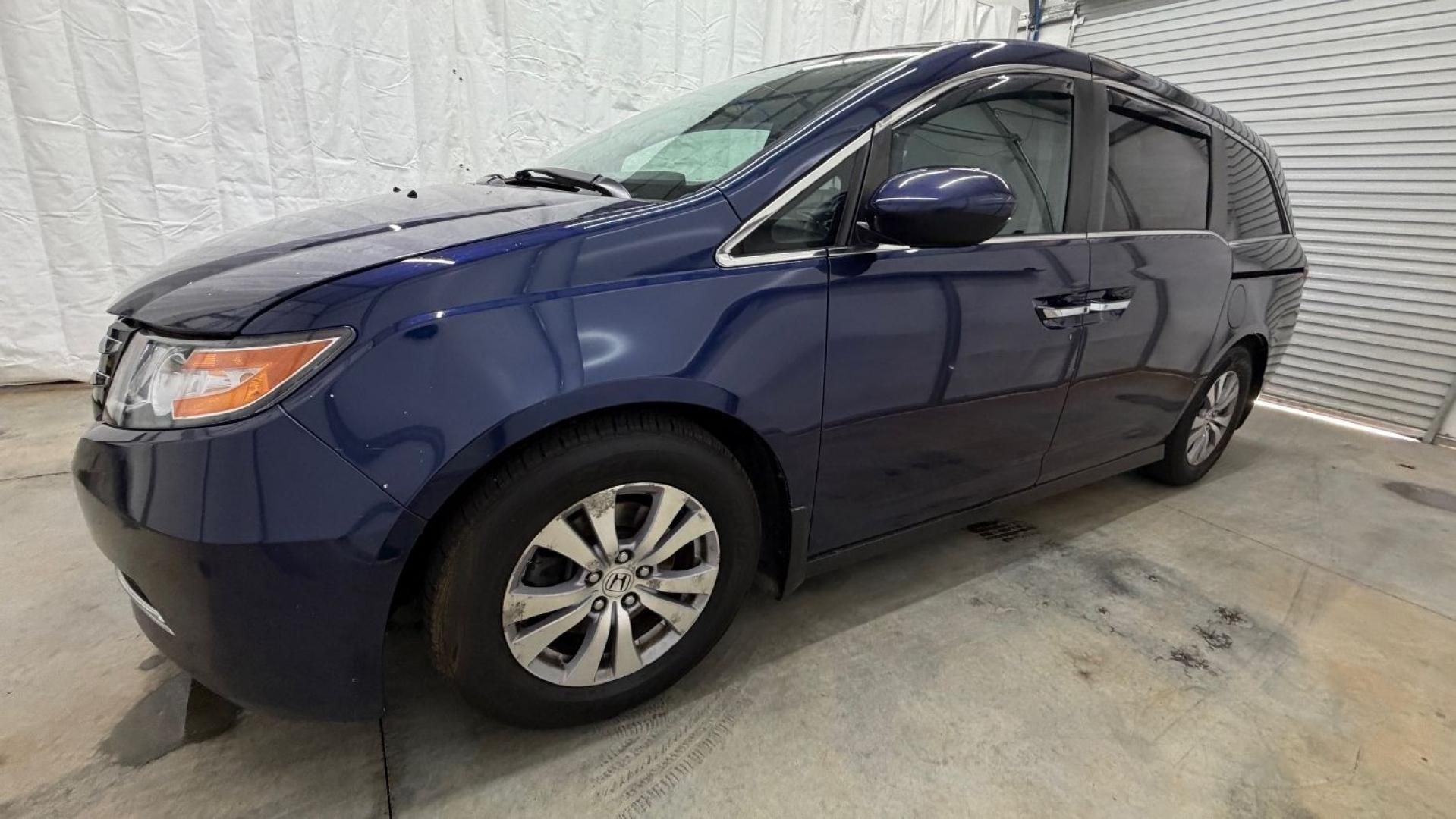 2016 Blue Honda Odyssey EX-L (5FNRL5H66GB) with an 3.5L V-6 i-VTEC variable valve control engine, located at 1806 Veterans Memorial Hwy SW, Austell, GA, 30168, (770) 944-9558, 33.817959, -84.606987- Photo#1