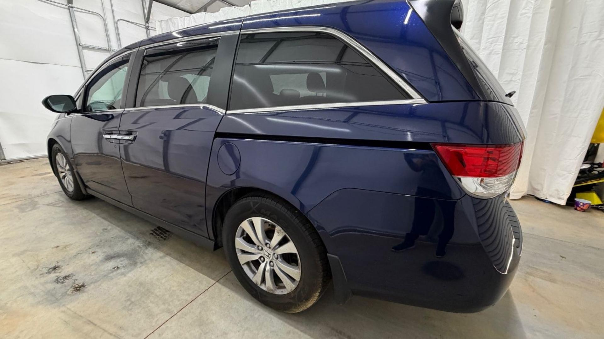 2016 Blue Honda Odyssey EX-L (5FNRL5H66GB) with an 3.5L V-6 i-VTEC variable valve control engine, located at 1806 Veterans Memorial Hwy SW, Austell, GA, 30168, (770) 944-9558, 33.817959, -84.606987- Photo#2