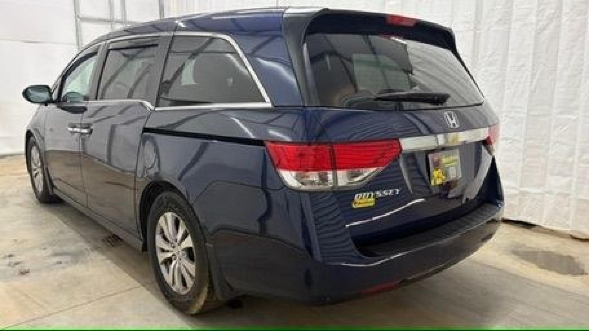 2016 Blue Honda Odyssey EX-L (5FNRL5H66GB) with an 3.5L V-6 i-VTEC variable valve control engine, located at 1806 Veterans Memorial Hwy SW, Austell, GA, 30168, (770) 944-9558, 33.817959, -84.606987- Photo#3