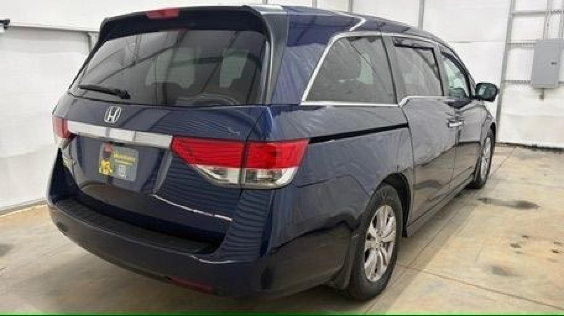 2016 Blue Honda Odyssey EX-L (5FNRL5H66GB) with an 3.5L V-6 i-VTEC variable valve control engine, located at 1806 Veterans Memorial Hwy SW, Austell, GA, 30168, (770) 944-9558, 33.817959, -84.606987- Photo#5