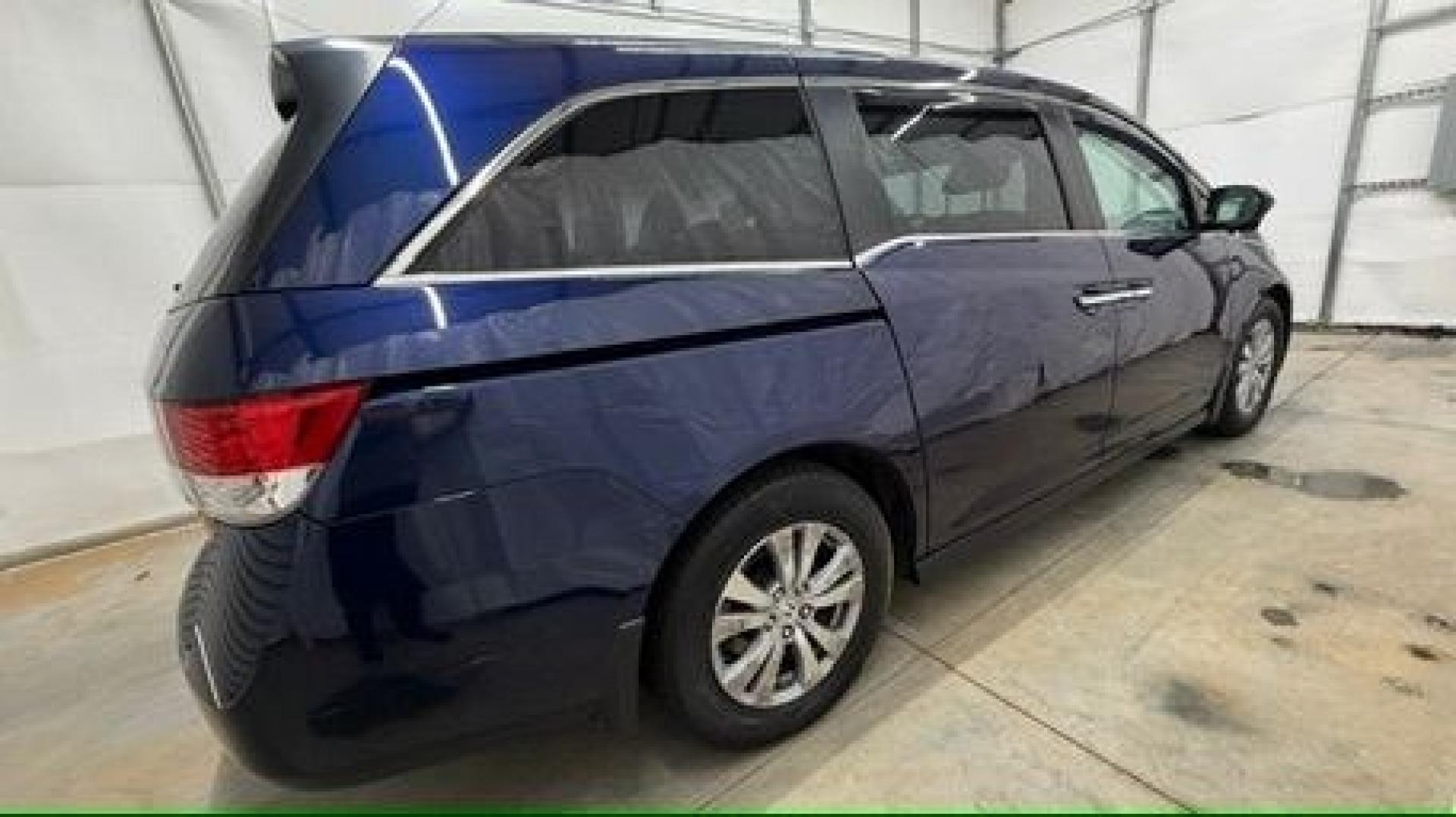 2016 Blue Honda Odyssey EX-L (5FNRL5H66GB) with an 3.5L V-6 i-VTEC variable valve control engine, located at 1806 Veterans Memorial Hwy SW, Austell, GA, 30168, (770) 944-9558, 33.817959, -84.606987- Photo#6