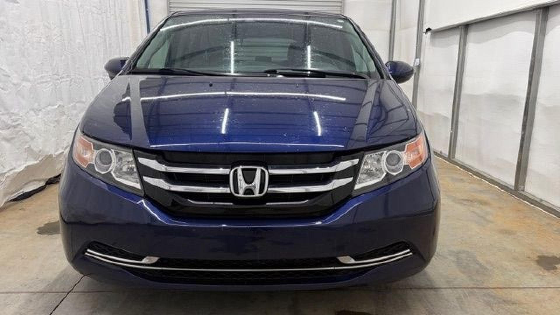 2016 Blue Honda Odyssey EX-L (5FNRL5H66GB) with an 3.5L V-6 i-VTEC variable valve control engine, located at 1806 Veterans Memorial Hwy SW, Austell, GA, 30168, (770) 944-9558, 33.817959, -84.606987- Photo#9