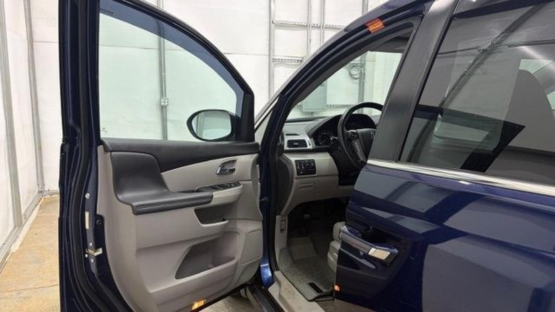 2016 Blue Honda Odyssey EX-L (5FNRL5H66GB) with an 3.5L V-6 i-VTEC variable valve control engine, located at 1806 Veterans Memorial Hwy SW, Austell, GA, 30168, (770) 944-9558, 33.817959, -84.606987- Photo#10