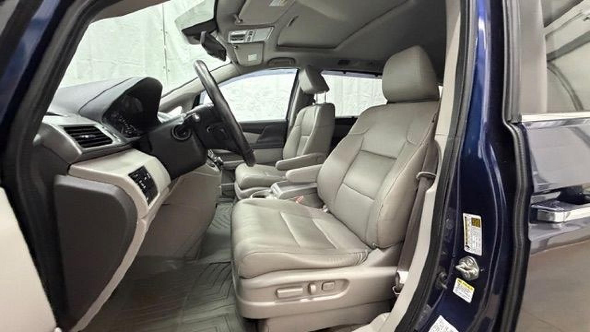 2016 Blue Honda Odyssey EX-L (5FNRL5H66GB) with an 3.5L V-6 i-VTEC variable valve control engine, located at 1806 Veterans Memorial Hwy SW, Austell, GA, 30168, (770) 944-9558, 33.817959, -84.606987- Photo#12