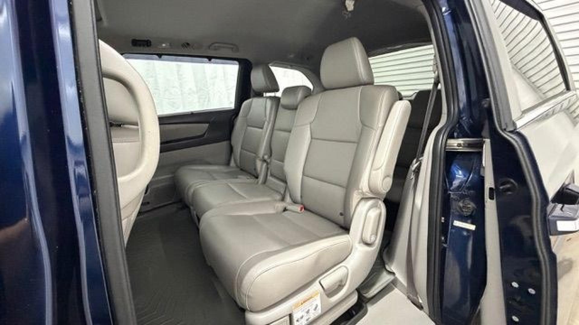 2016 Blue Honda Odyssey EX-L (5FNRL5H66GB) with an 3.5L V-6 i-VTEC variable valve control engine, located at 1806 Veterans Memorial Hwy SW, Austell, GA, 30168, (770) 944-9558, 33.817959, -84.606987- Photo#13