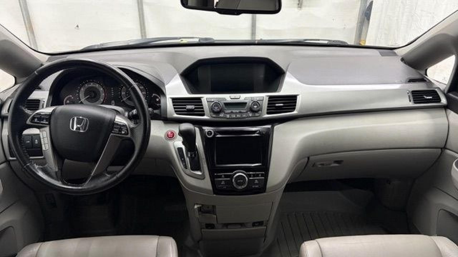 2016 Blue Honda Odyssey EX-L (5FNRL5H66GB) with an 3.5L V-6 i-VTEC variable valve control engine, located at 1806 Veterans Memorial Hwy SW, Austell, GA, 30168, (770) 944-9558, 33.817959, -84.606987- Photo#15