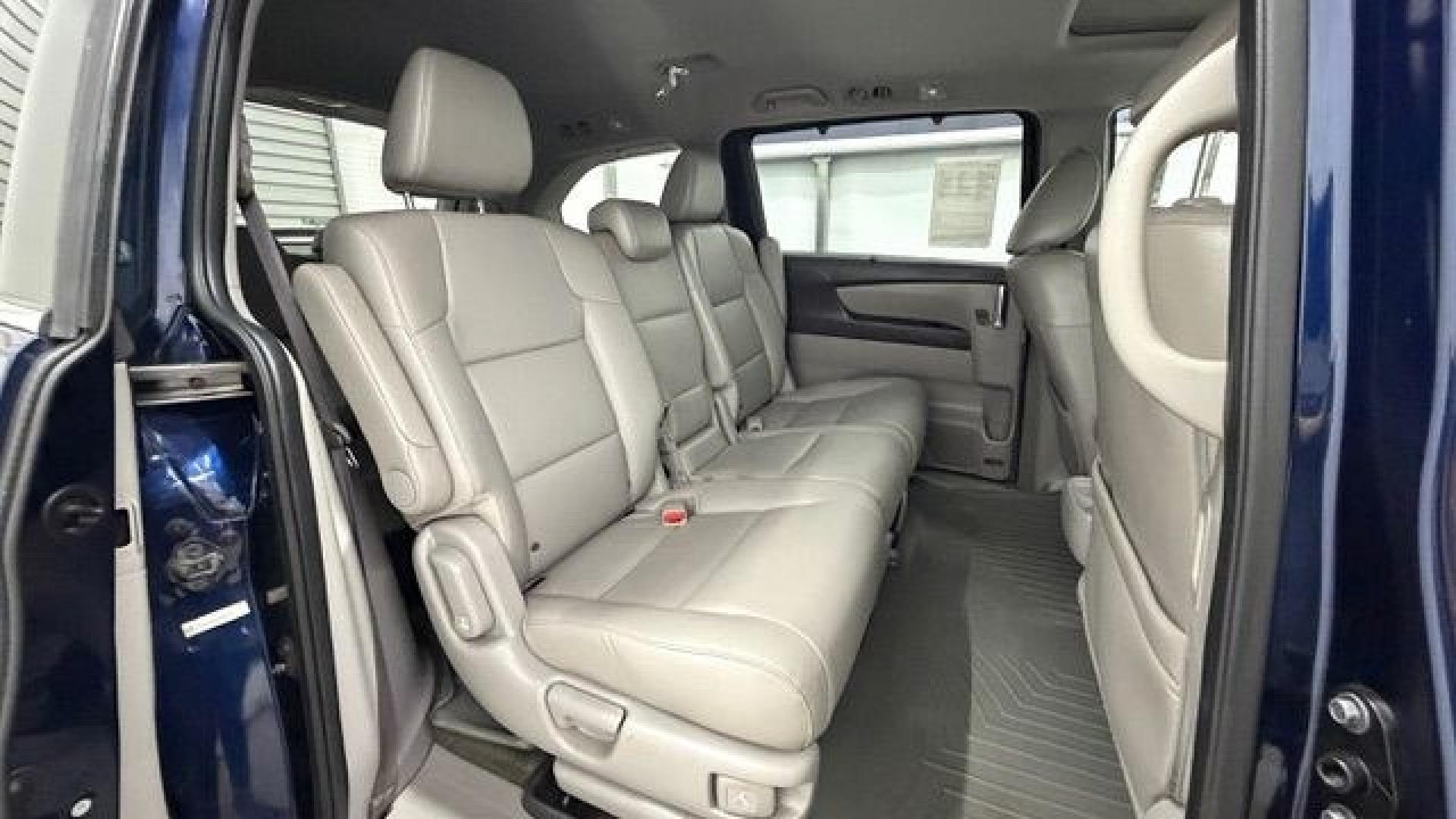 2016 Blue Honda Odyssey EX-L (5FNRL5H66GB) with an 3.5L V-6 i-VTEC variable valve control engine, located at 1806 Veterans Memorial Hwy SW, Austell, GA, 30168, (770) 944-9558, 33.817959, -84.606987- Photo#17