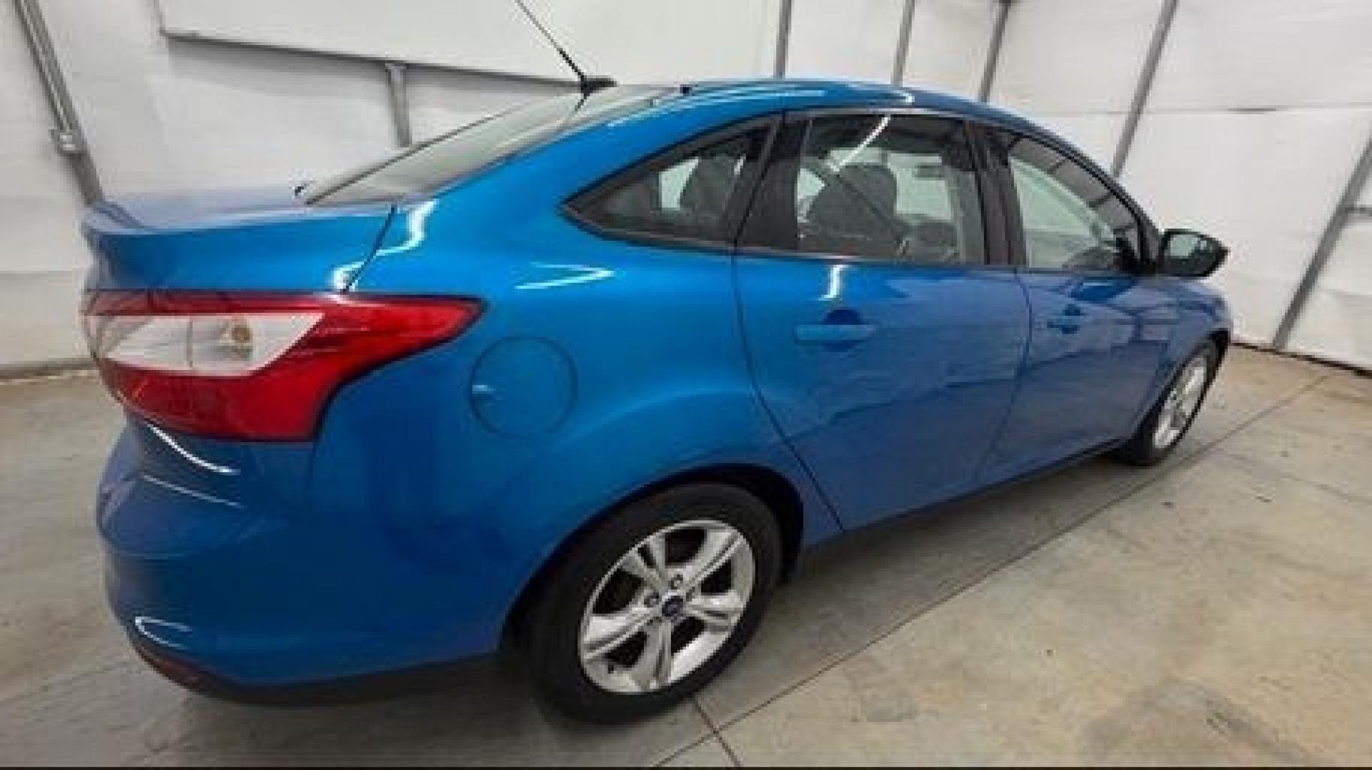 2014 Blue Ford Focus SE (1FADP3F2XEL) with an 2L I-4 gasoline direct injection engine, located at 1806 Veterans Memorial Hwy SW, Austell, GA, 30168, (770) 944-9558, 33.817959, -84.606987 - Why Choose Automania? At Automania, we make car buying easy and stress-free, with over 20 years serving Austell, GA and the surrounding communities. WE FINANCE GOOD AND NOT SO GOOD CREDIT, we work with all credit types, and every vehicle comes with a free vehicle history report so you know its backg- Photo#6