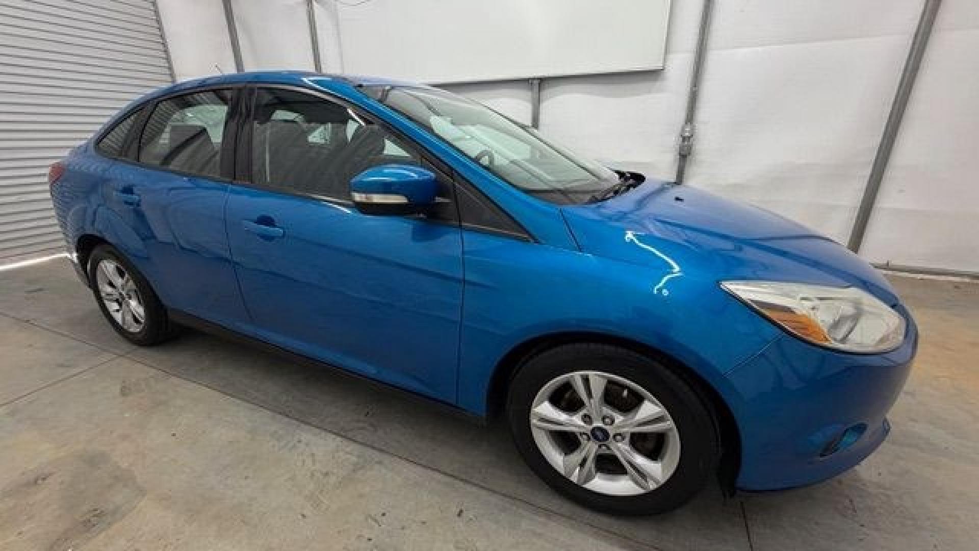 2014 Blue Ford Focus SE (1FADP3F2XEL) with an 2L I-4 gasoline direct injection engine, located at 1806 Veterans Memorial Hwy SW, Austell, GA, 30168, (770) 944-9558, 33.817959, -84.606987 - Why Choose Automania? At Automania, we make car buying easy and stress-free, with over 20 years serving Austell, GA and the surrounding communities. WE FINANCE GOOD AND NOT SO GOOD CREDIT, we work with all credit types, and every vehicle comes with a free vehicle history report so you know its backg- Photo#7