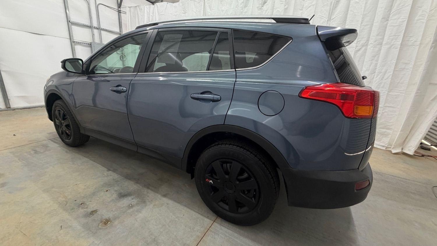 2014 Blue Toyota RAV4 LE (2T3ZFREV3EW) with an 2.5L I-4 DOHC engine, located at 1806 Veterans Memorial Hwy SW, Austell, GA, 30168, (770) 944-9558, 33.817959, -84.606987 - Photo#2