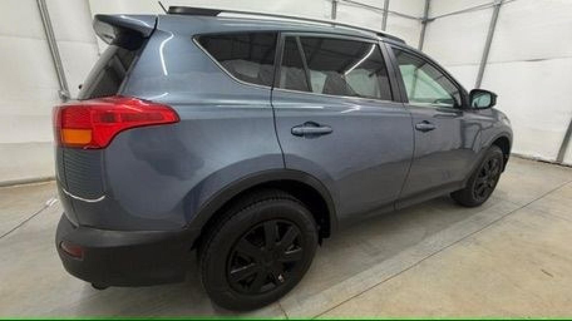 2014 Blue Toyota RAV4 LE (2T3ZFREV3EW) with an 2.5L I-4 DOHC engine, located at 1806 Veterans Memorial Hwy SW, Austell, GA, 30168, (770) 944-9558, 33.817959, -84.606987 - Why Choose Automania? At Automania, we make car buying easy and stress-free, with over 20 years serving Austell, GA and the surrounding communities. WE FINANCE GOOD AND NOT SO GOOD CREDIT, we work with all credit types, and every vehicle comes with a free vehicle history report so you know its backg- Photo#6