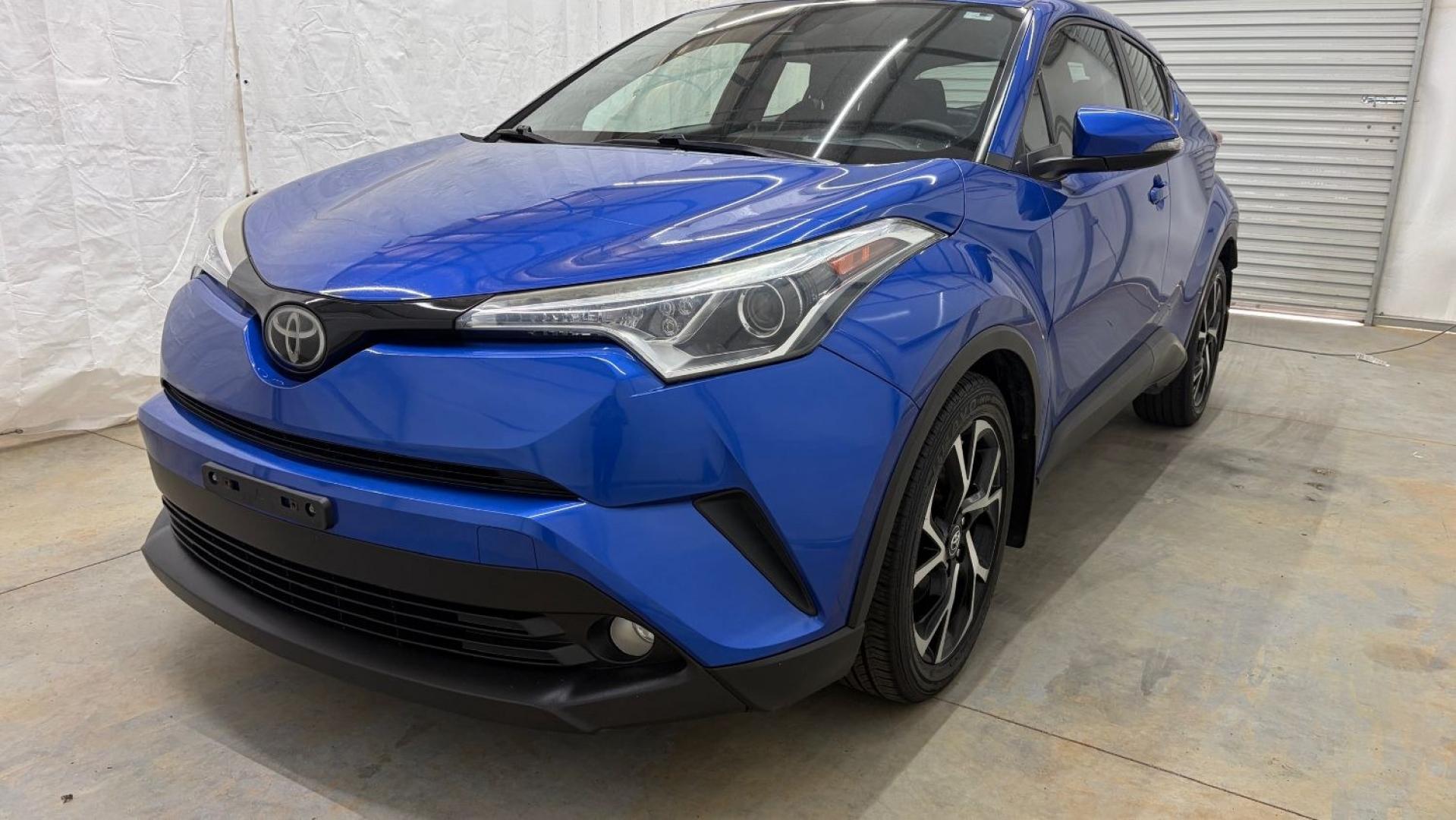 2018 Blue Toyota C-HR XLE Premium (NMTKHMBX7JR) with an 2L I-4 DOHC engine, located at 1806 Veterans Memorial Hwy SW, Austell, GA, 30168, (770) 944-9558, 33.817959, -84.606987- Photo#0
