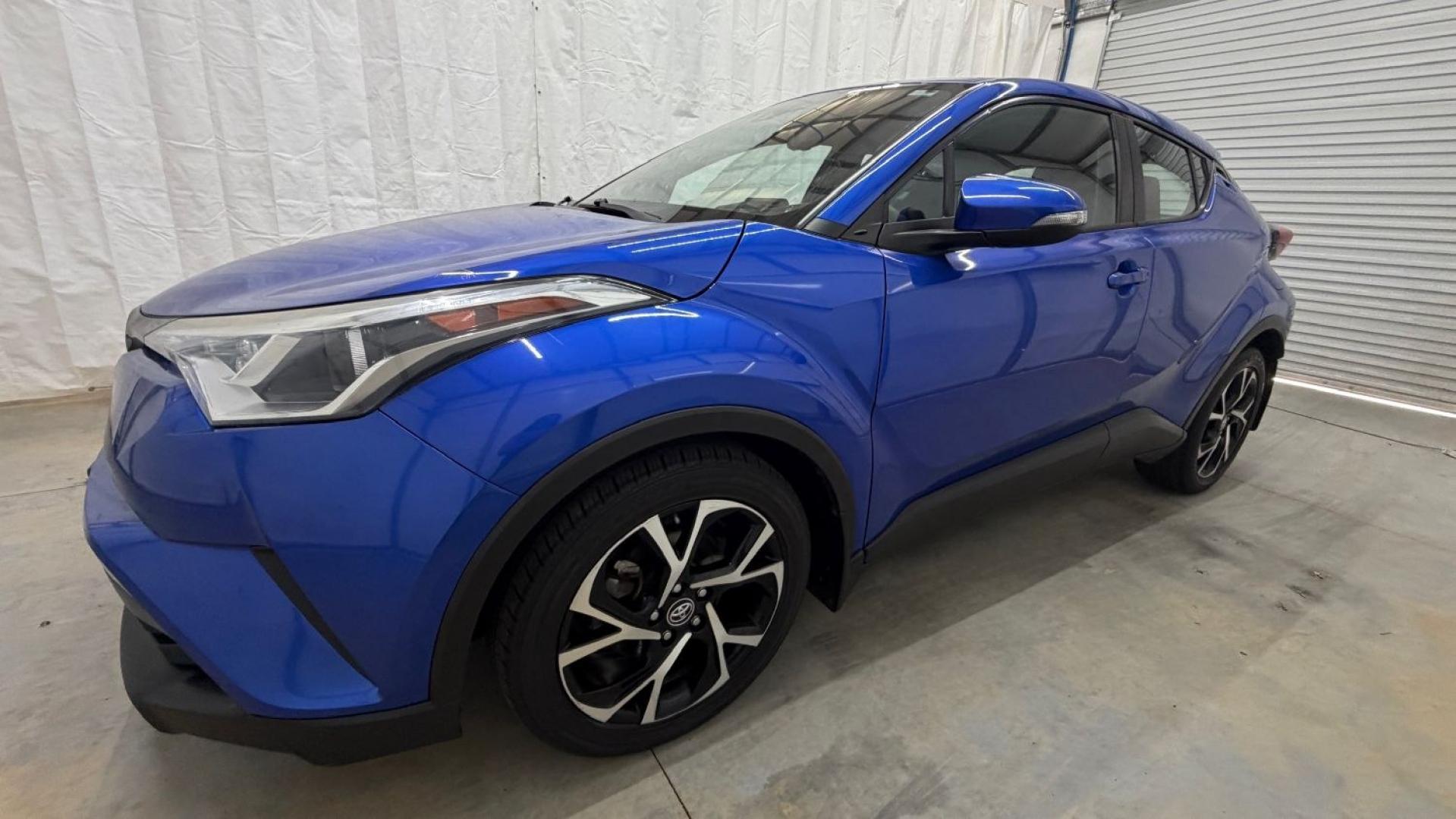 2018 Blue Toyota C-HR XLE Premium (NMTKHMBX7JR) with an 2L I-4 DOHC engine, located at 1806 Veterans Memorial Hwy SW, Austell, GA, 30168, (770) 944-9558, 33.817959, -84.606987- Photo#1