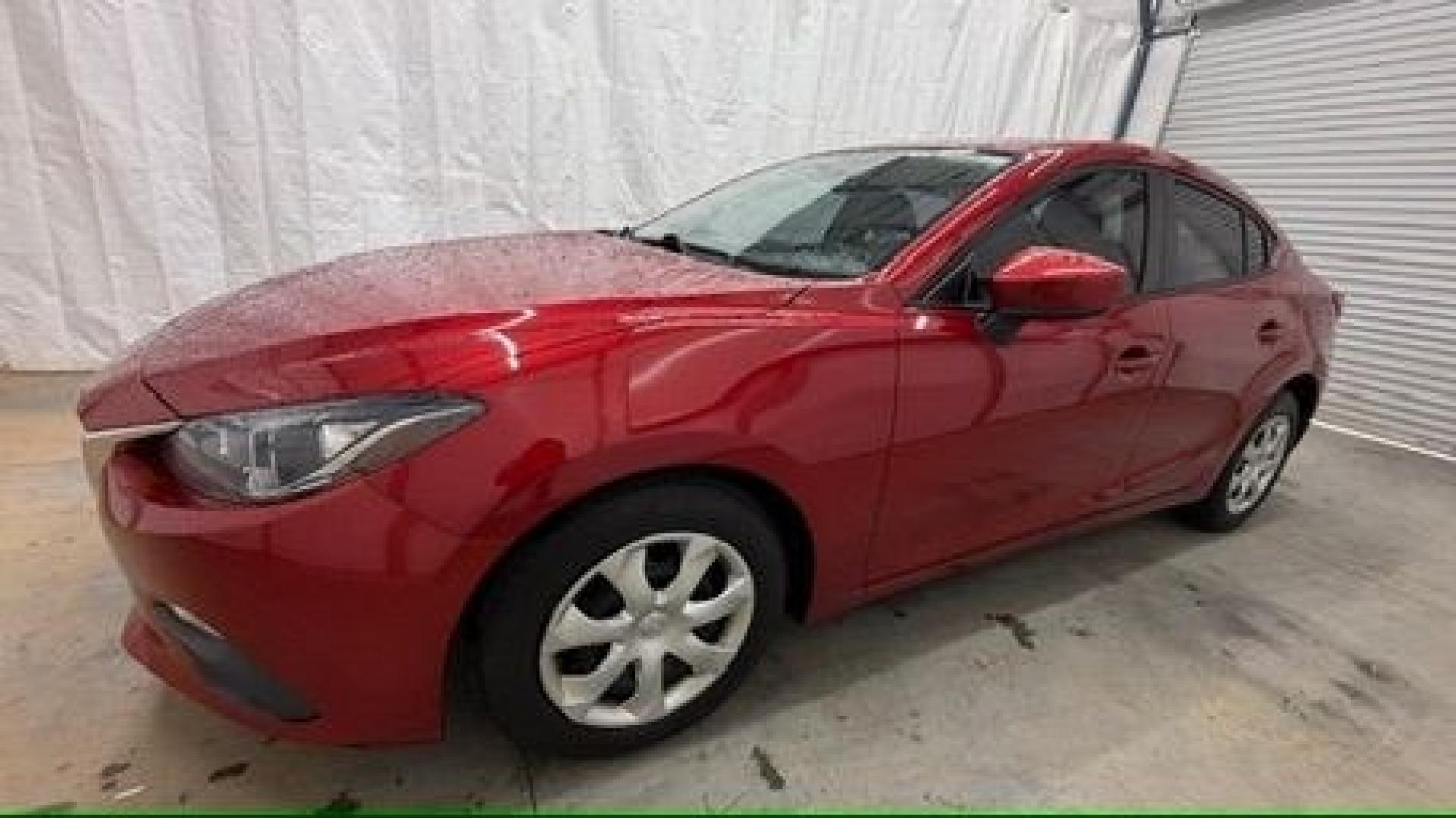 2016 Red Mazda Mazda3 i Sport (3MZBM1T71GM) with an SKYACTIV-G 2L I-4 gasoline direct injection engine, located at 1806 Veterans Memorial Hwy SW, Austell, GA, 30168, (770) 944-9558, 33.817959, -84.606987- Photo#1