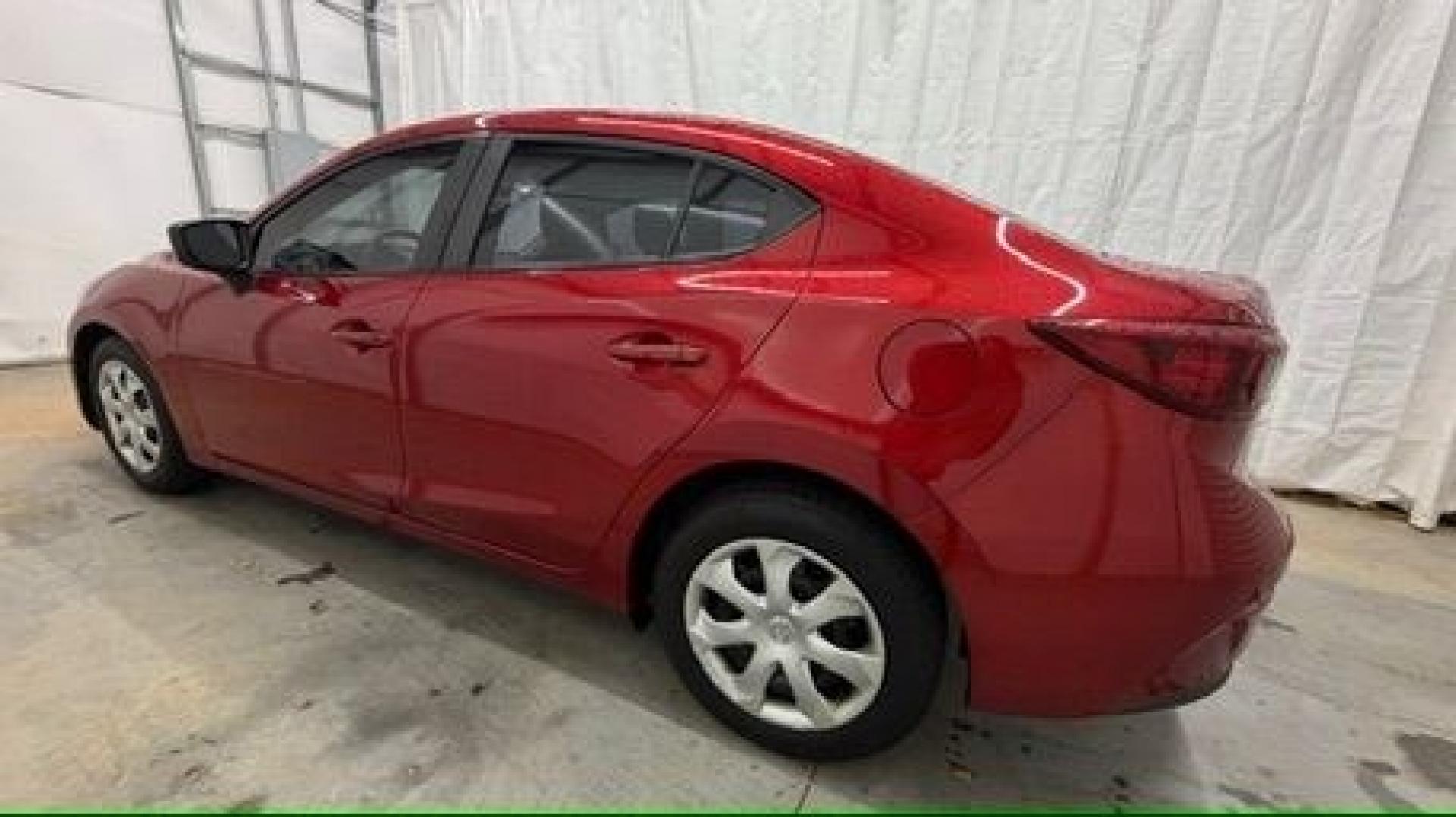 2016 Red Mazda Mazda3 i Sport (3MZBM1T71GM) with an SKYACTIV-G 2L I-4 gasoline direct injection engine, located at 1806 Veterans Memorial Hwy SW, Austell, GA, 30168, (770) 944-9558, 33.817959, -84.606987- Photo#2