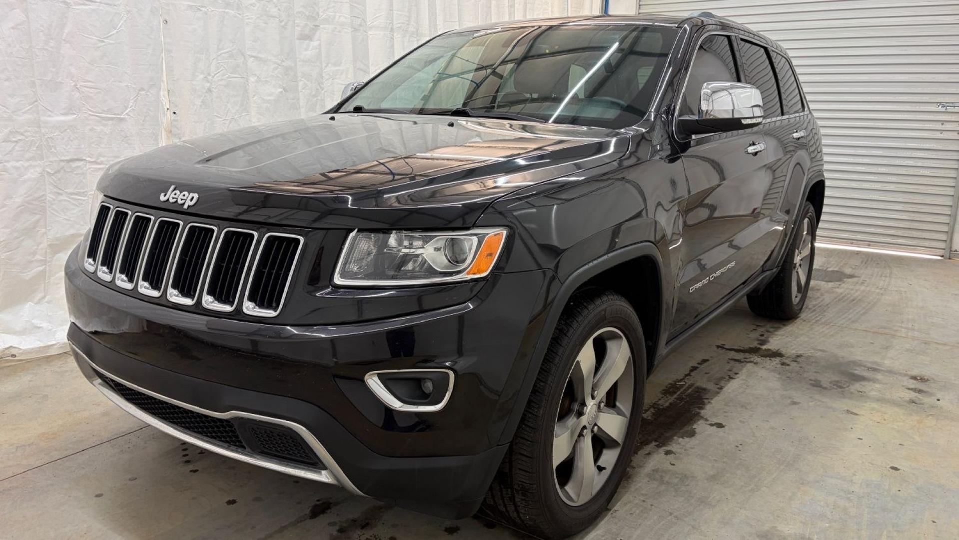2015 Black Jeep Grand Cherokee Limited (1C4RJEBGXFC) , located at 1806 Veterans Memorial Hwy SW, Austell, GA, 30168, (770) 944-9558, 33.817959, -84.606987- Photo#0