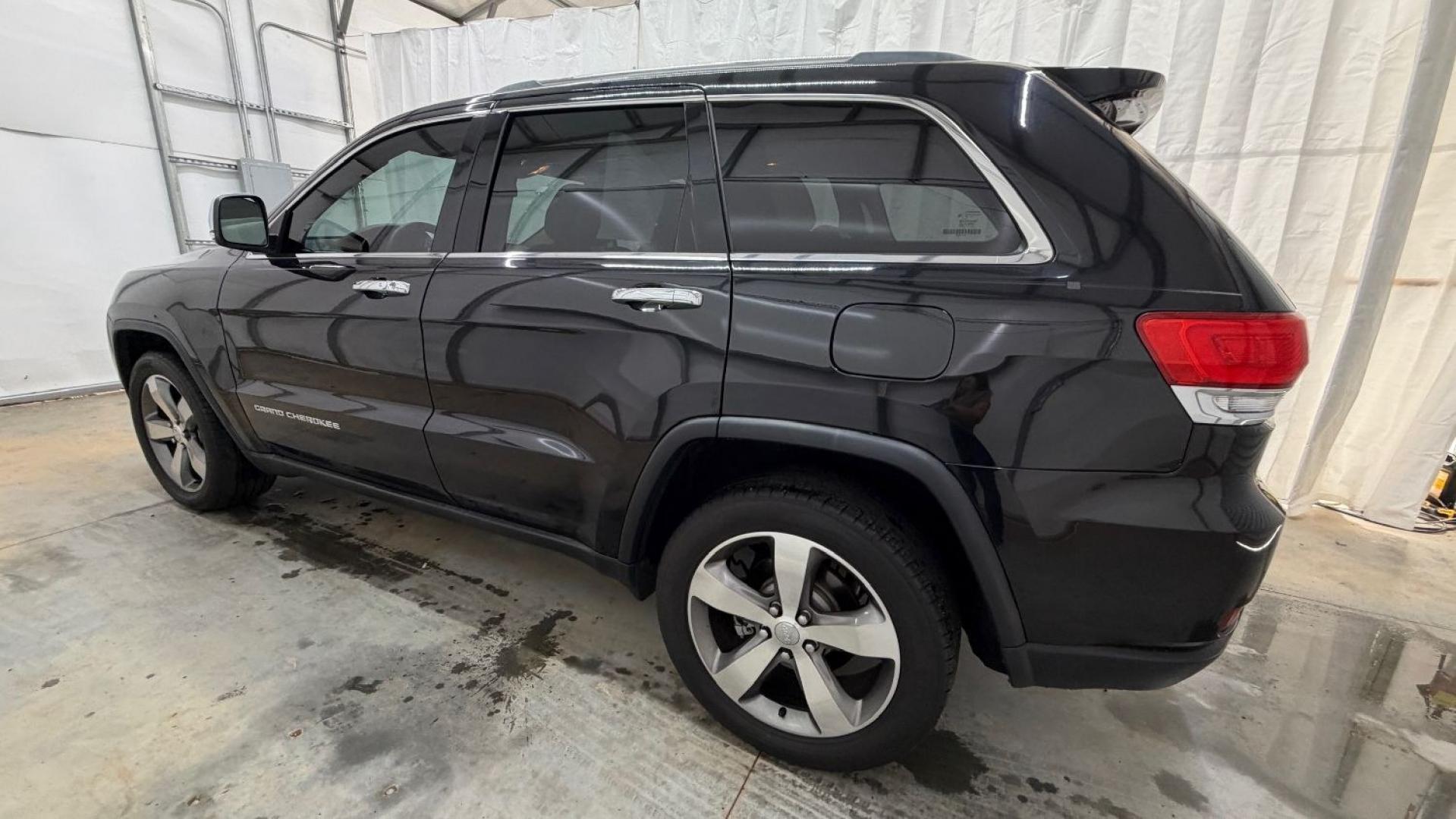 2015 Black Jeep Grand Cherokee Limited (1C4RJEBGXFC) , located at 1806 Veterans Memorial Hwy SW, Austell, GA, 30168, (770) 944-9558, 33.817959, -84.606987- Photo#2
