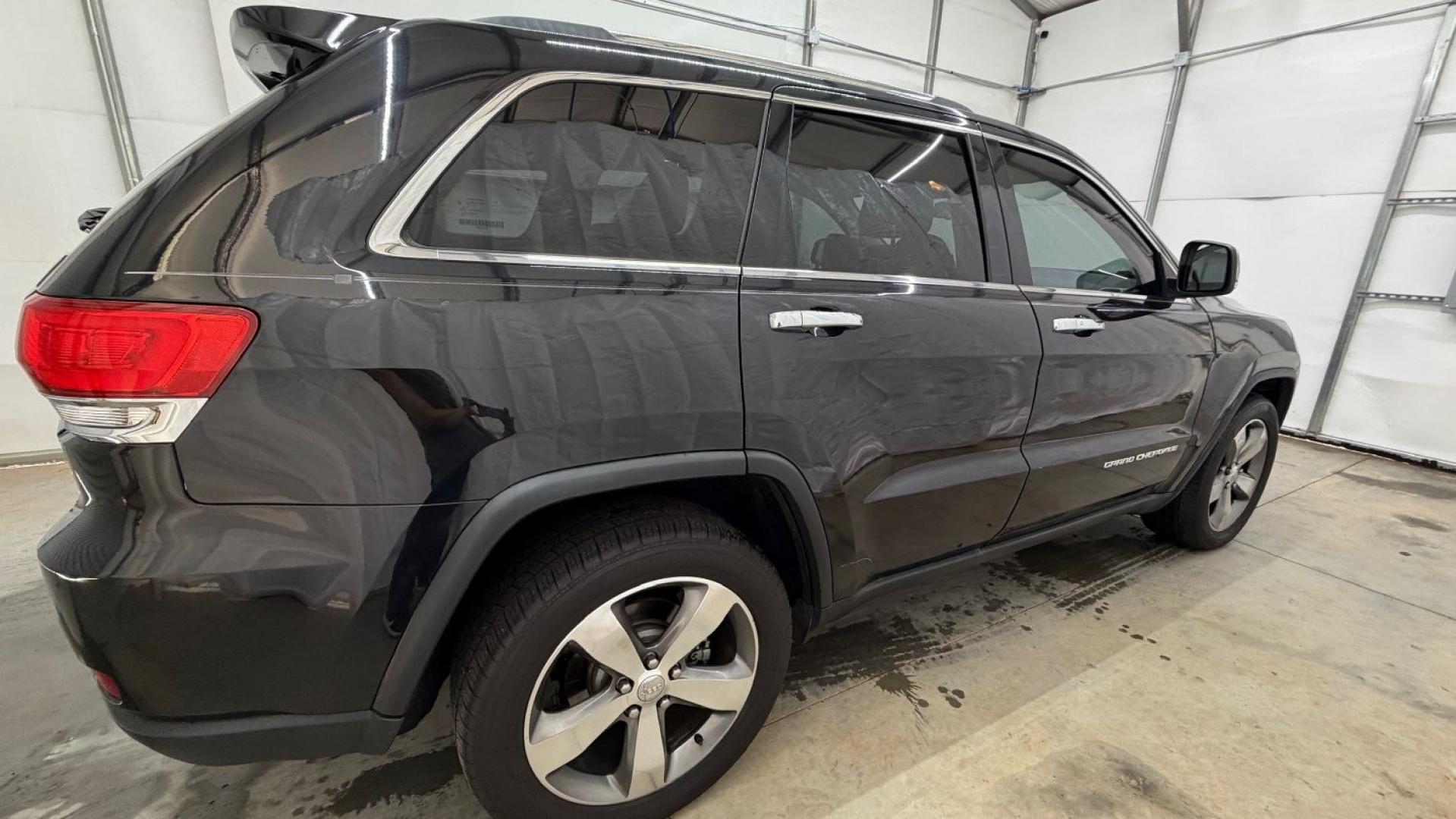 2015 Black Jeep Grand Cherokee Limited (1C4RJEBGXFC) , located at 1806 Veterans Memorial Hwy SW, Austell, GA, 30168, (770) 944-9558, 33.817959, -84.606987- Photo#7