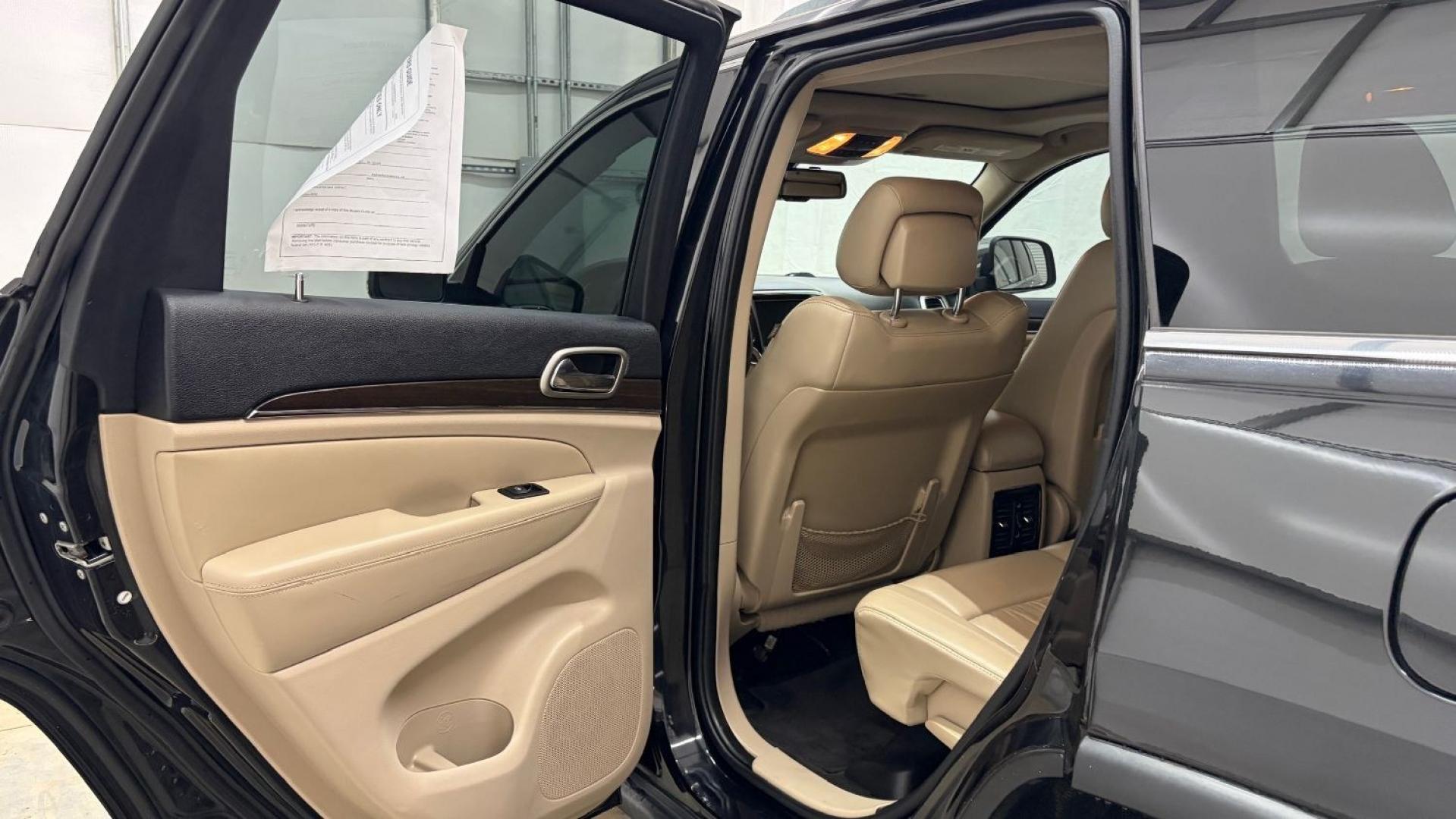 2015 Black Jeep Grand Cherokee Limited (1C4RJEBGXFC) , located at 1806 Veterans Memorial Hwy SW, Austell, GA, 30168, (770) 944-9558, 33.817959, -84.606987- Photo#14