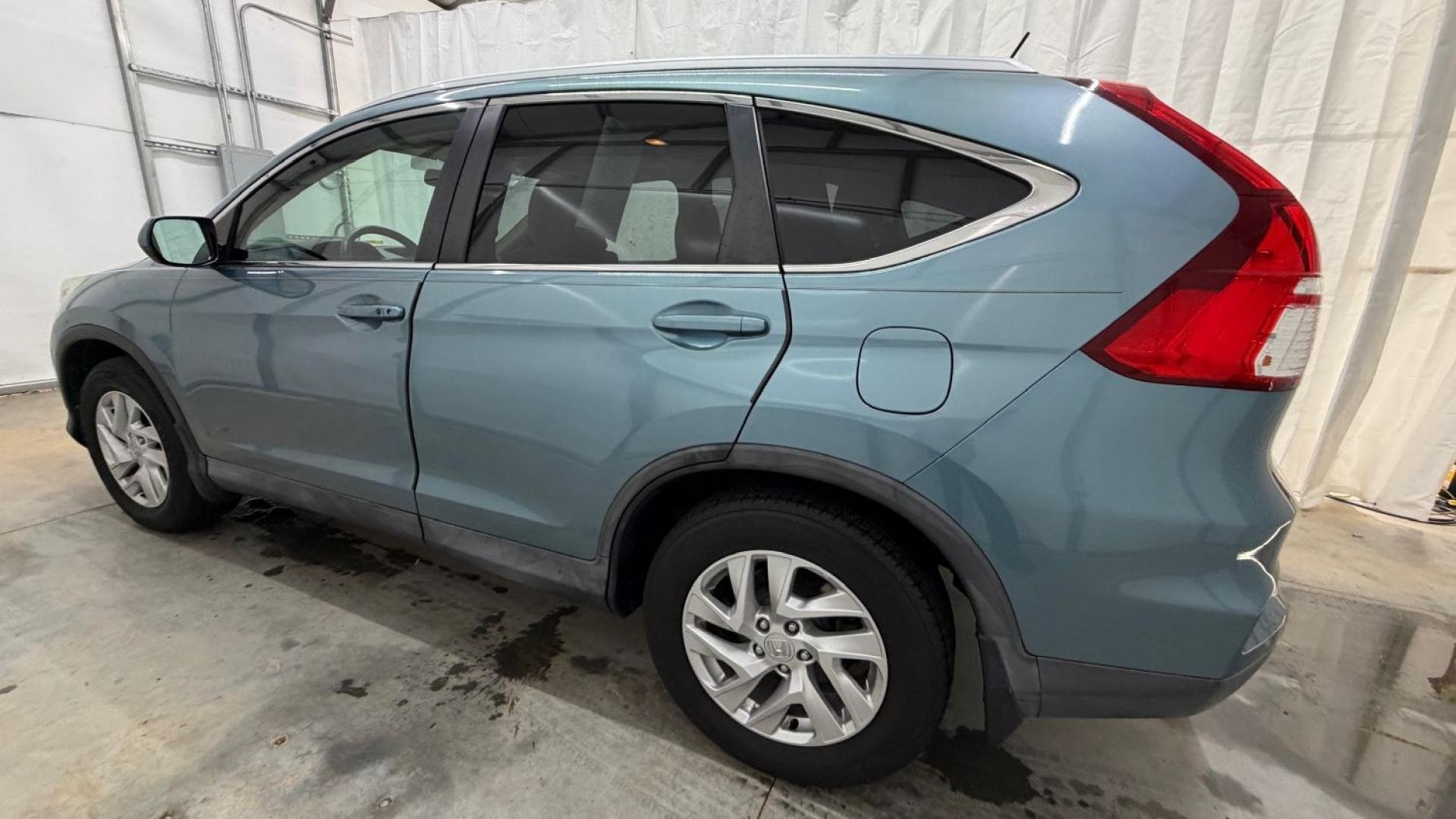 2015 Teal Honda CR-V EX-L (2HKRM3H79FH) with an 2.4L I-4 gasoline direct injection engine, located at 1806 Veterans Memorial Hwy SW, Austell, GA, 30168, (770) 944-9558, 33.817959, -84.606987- Photo#2