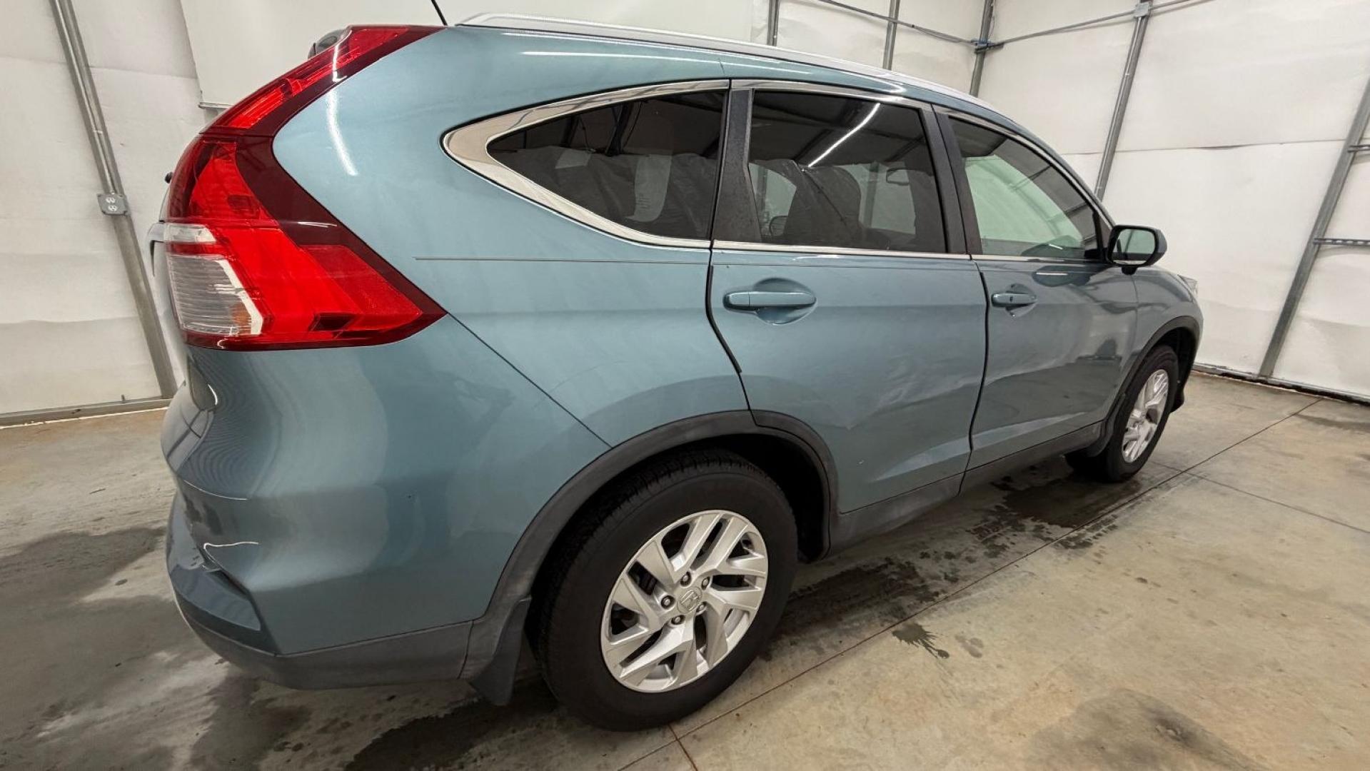 2015 Teal Honda CR-V EX-L (2HKRM3H79FH) with an 2.4L I-4 gasoline direct injection engine, located at 1806 Veterans Memorial Hwy SW, Austell, GA, 30168, (770) 944-9558, 33.817959, -84.606987- Photo#7