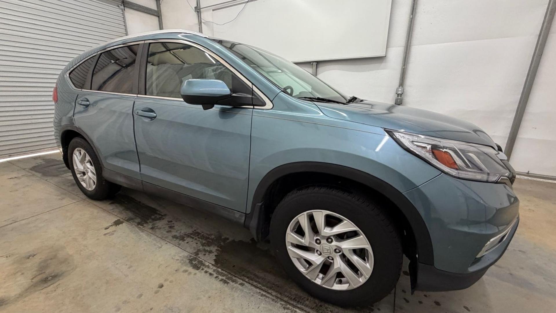 2015 Teal Honda CR-V EX-L (2HKRM3H79FH) with an 2.4L I-4 gasoline direct injection engine, located at 1806 Veterans Memorial Hwy SW, Austell, GA, 30168, (770) 944-9558, 33.817959, -84.606987- Photo#8