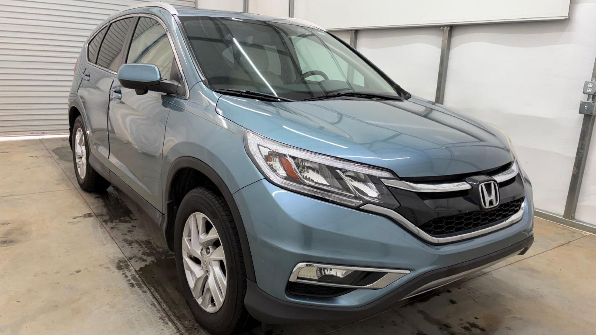 2015 Teal Honda CR-V EX-L (2HKRM3H79FH) with an 2.4L I-4 gasoline direct injection engine, located at 1806 Veterans Memorial Hwy SW, Austell, GA, 30168, (770) 944-9558, 33.817959, -84.606987- Photo#9