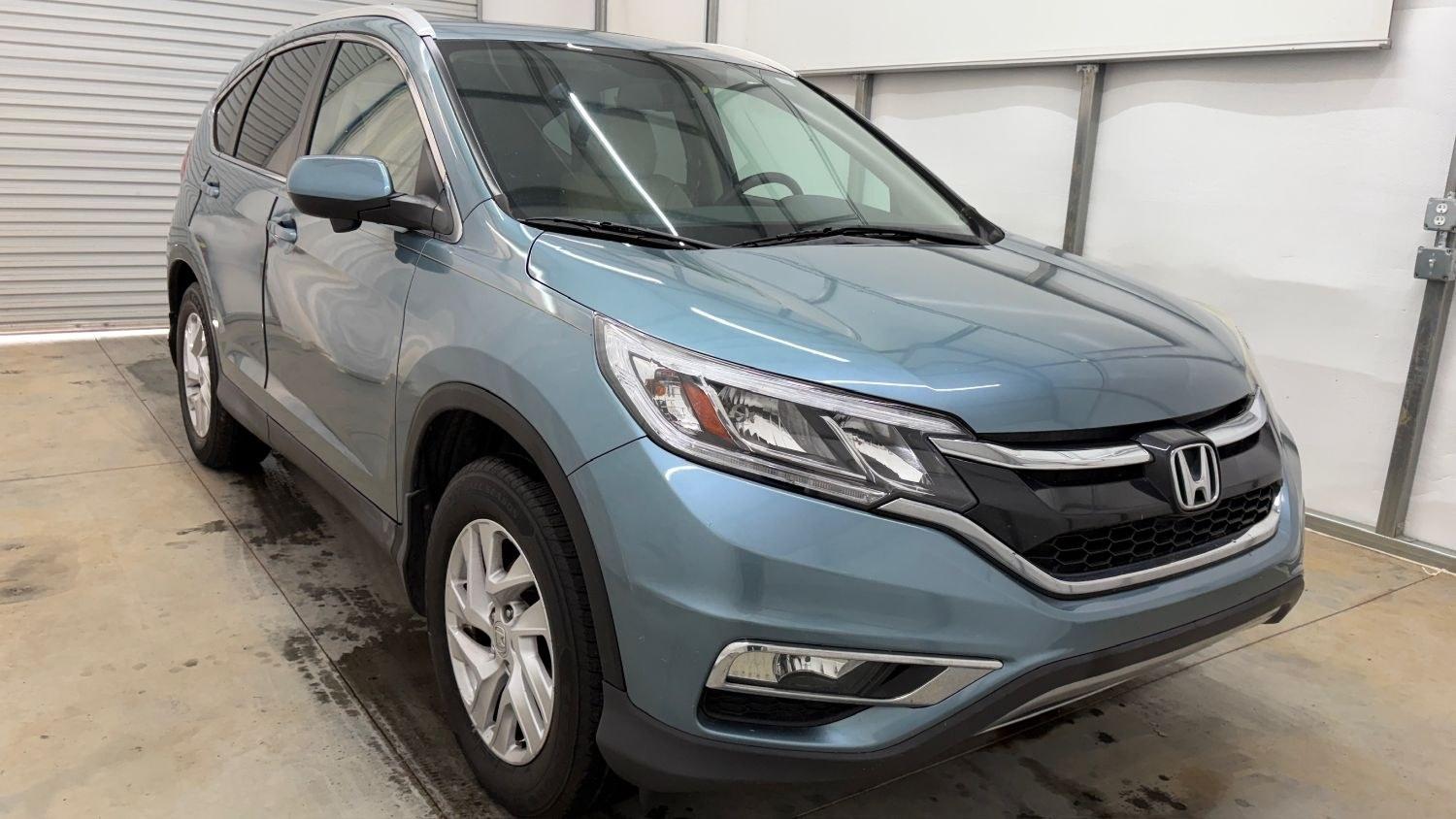 2015 Teal Honda CR-V EX-L (2HKRM3H79FH) with an 2.4L I-4 gasoline direct injection engine, located at 1806 Veterans Memorial Hwy SW, Austell, GA, 30168, (770) 944-9558, 33.817959, -84.606987- Photo#9