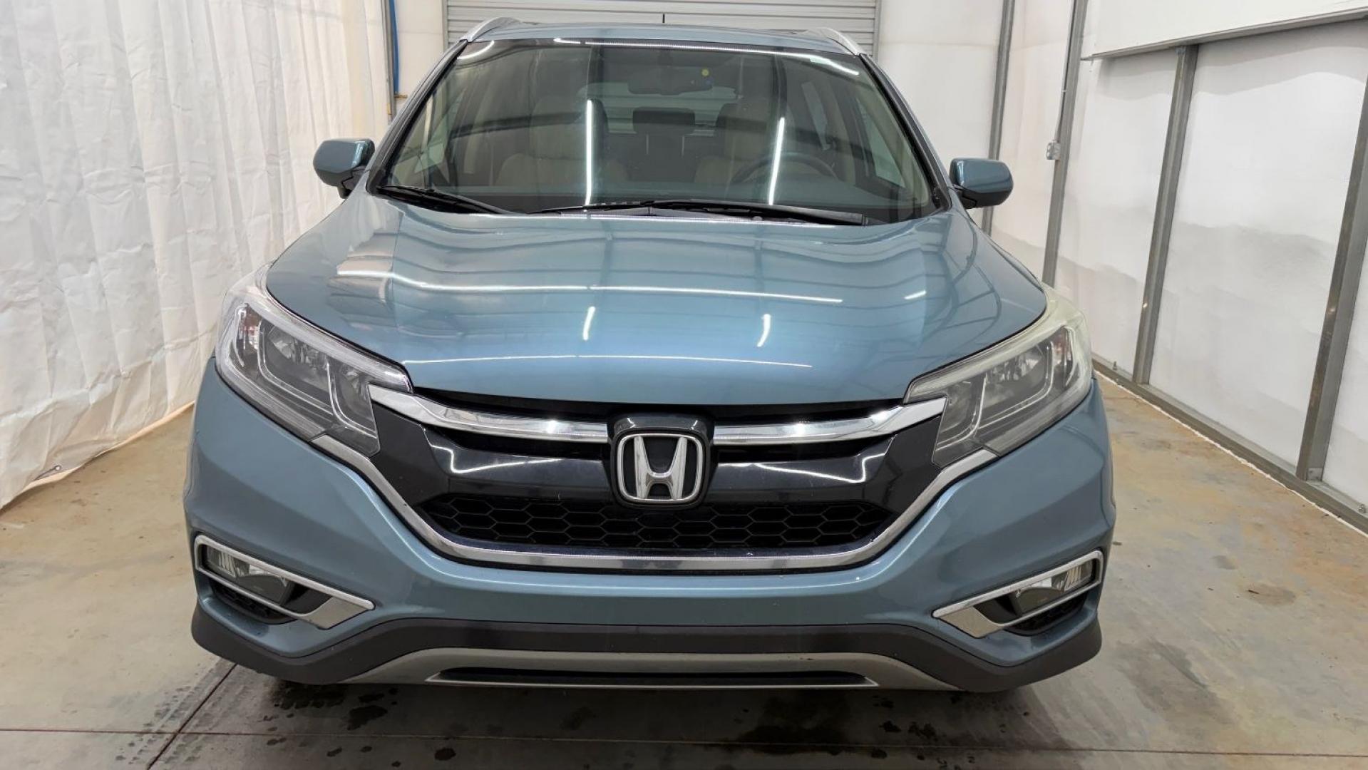 2015 Teal Honda CR-V EX-L (2HKRM3H79FH) with an 2.4L I-4 gasoline direct injection engine, located at 1806 Veterans Memorial Hwy SW, Austell, GA, 30168, (770) 944-9558, 33.817959, -84.606987- Photo#10