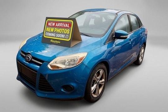 2014 Blue Ford Focus SE (1FADP3F20EL) with an 2L I-4 gasoline direct injection engine, located at 1806 Veterans Memorial Hwy SW, Austell, GA, 30168, (770) 944-9558, 33.817959, -84.606987 - Photo#0